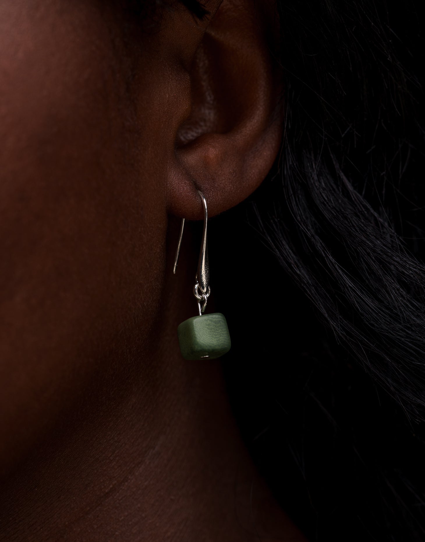 Clara Tagua Earrings featuring handmade tagua nut cubes with silver plated hooks, showcasing eco-friendly craftsmanship.