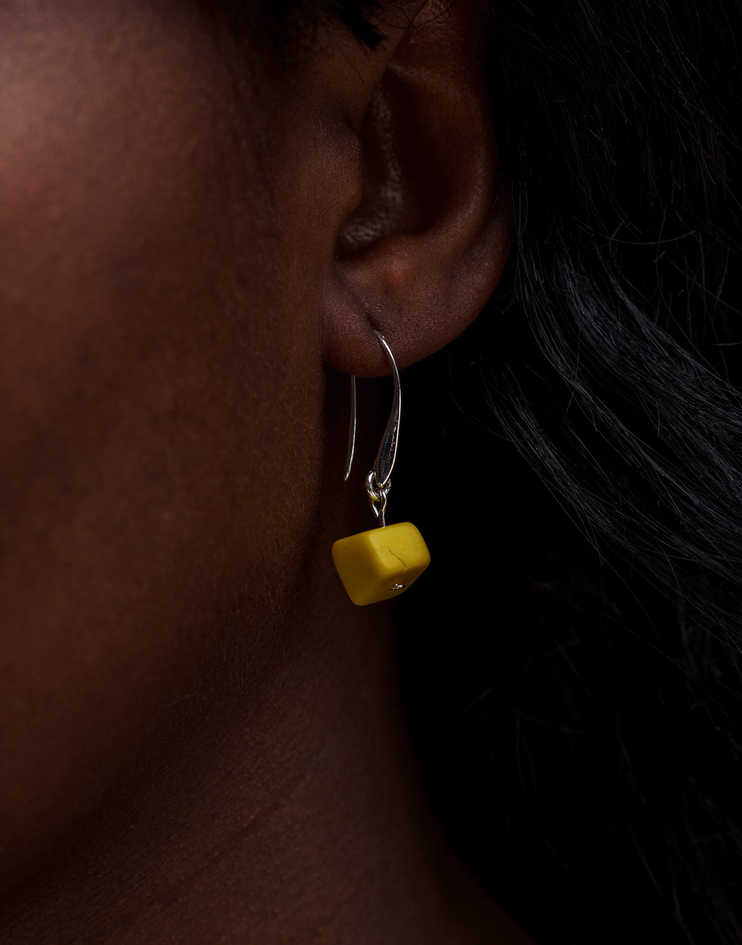 Clara Tagua Earrings featuring handmade tagua nut cubes with silver plated hooks, showcasing eco-friendly craftsmanship.