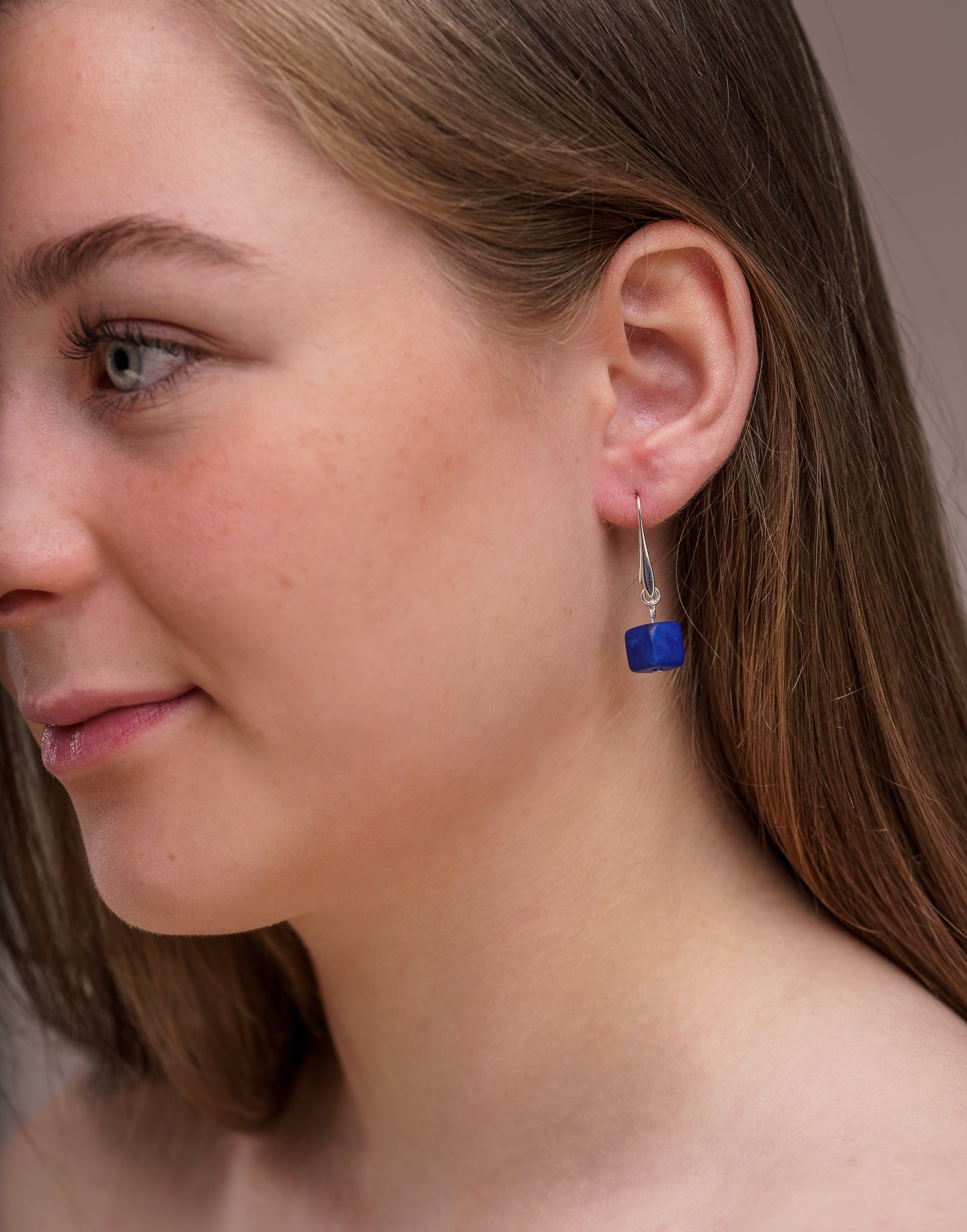 Clara Tagua Earrings featuring handmade tagua nut cubes with silver plated hooks, showcasing eco-friendly craftsmanship.