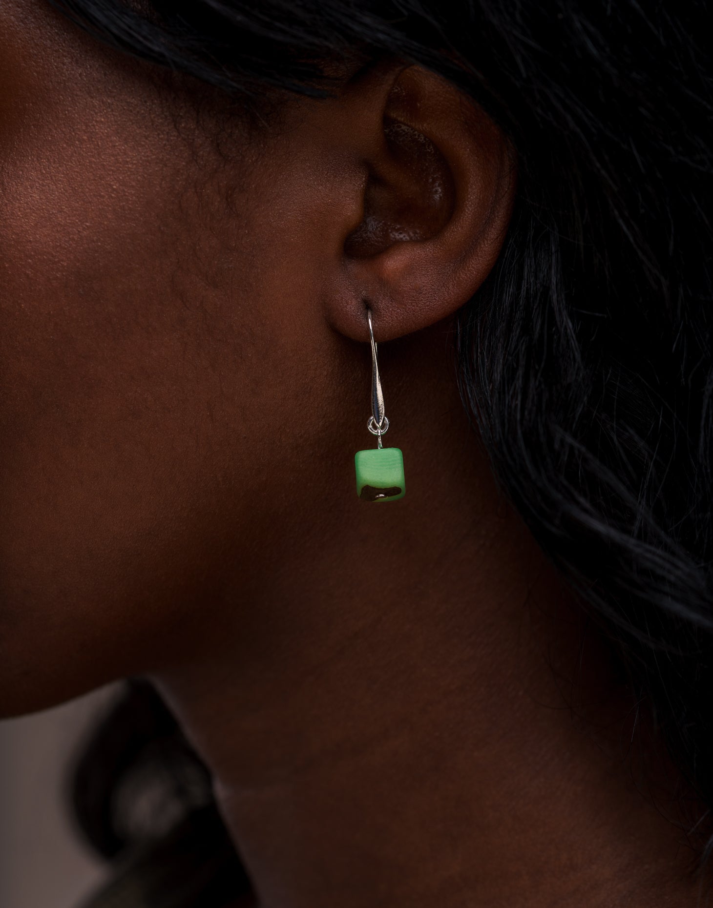 Clara Tagua Earrings featuring handmade tagua nut cubes with silver plated hooks, showcasing eco-friendly craftsmanship.