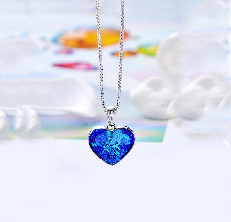 Classic Bermuda blue heart necklace designed in Italy, featuring 18K white gold plating and embellished with sparkling Austrian crystals.