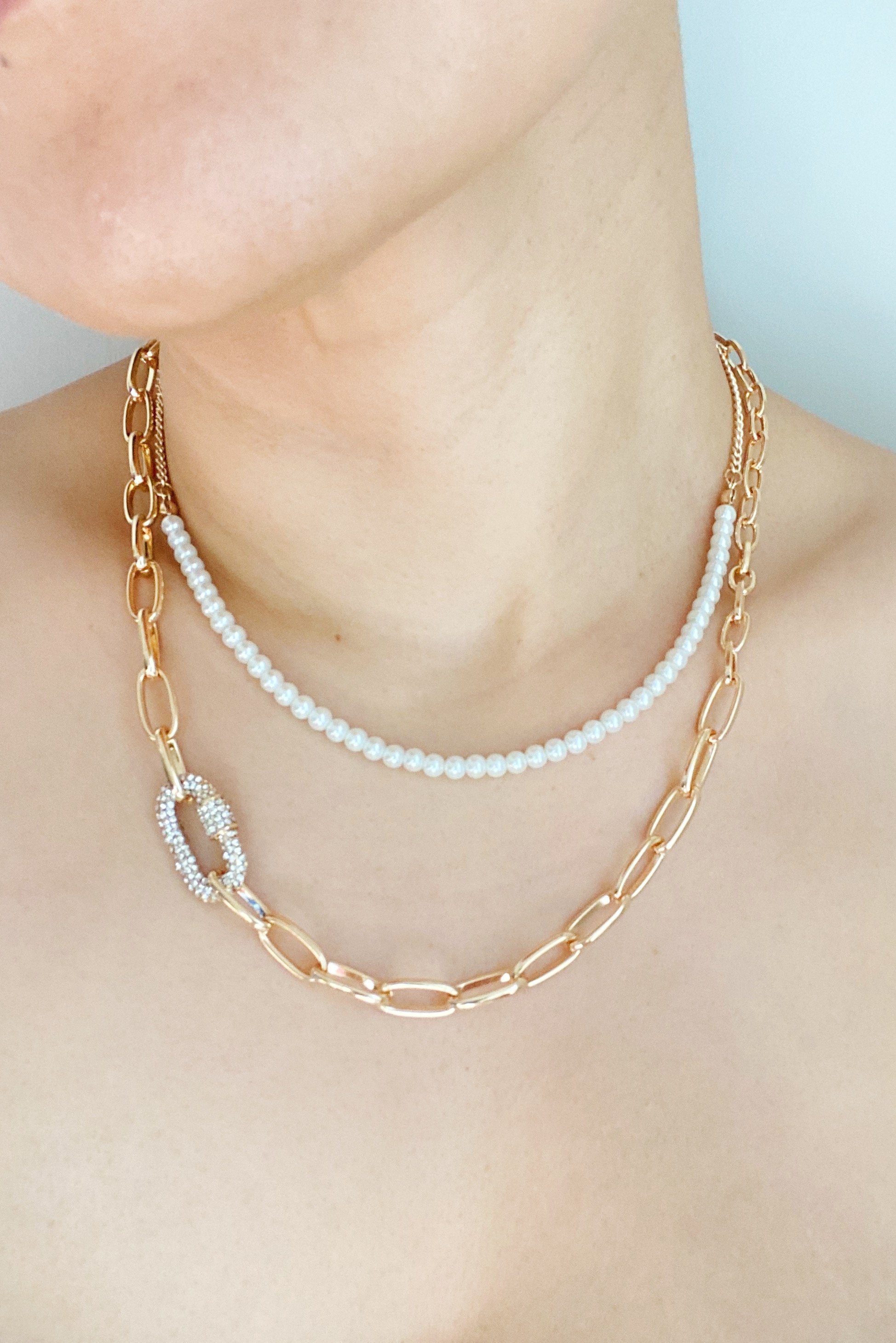 Classic Duo Layered Pearl Necklace Set featuring pearl beads and chunky link chain, elegantly displayed.