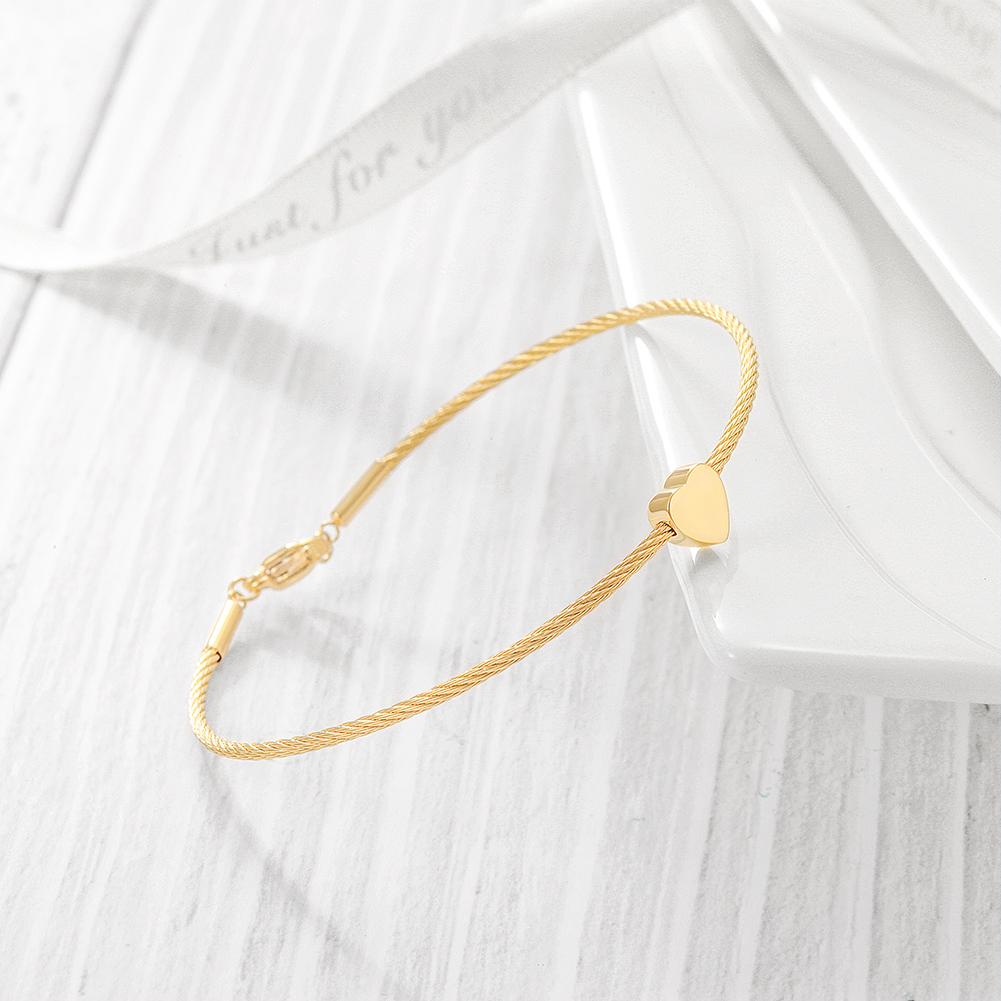 A stylish Classic Heart Cable Bangle Bracelet made of stainless steel with 14K gold plating, featuring a heart design.