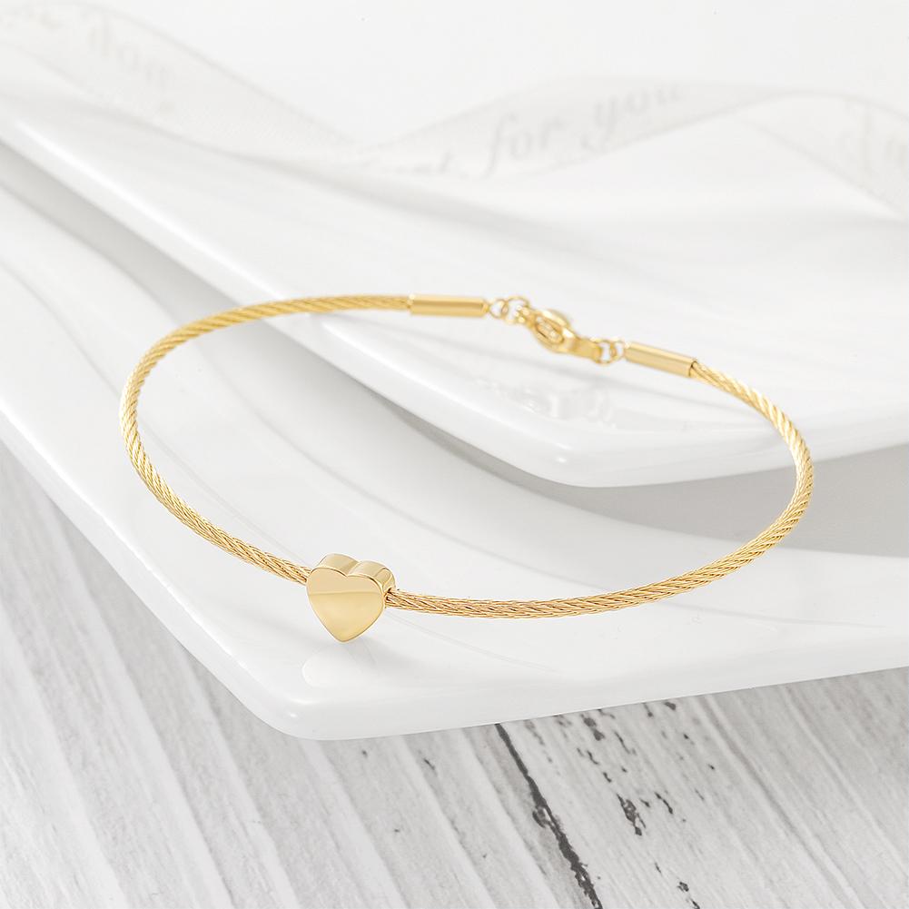 A stylish Classic Heart Cable Bangle Bracelet made of stainless steel with 14K gold plating, featuring a heart design.