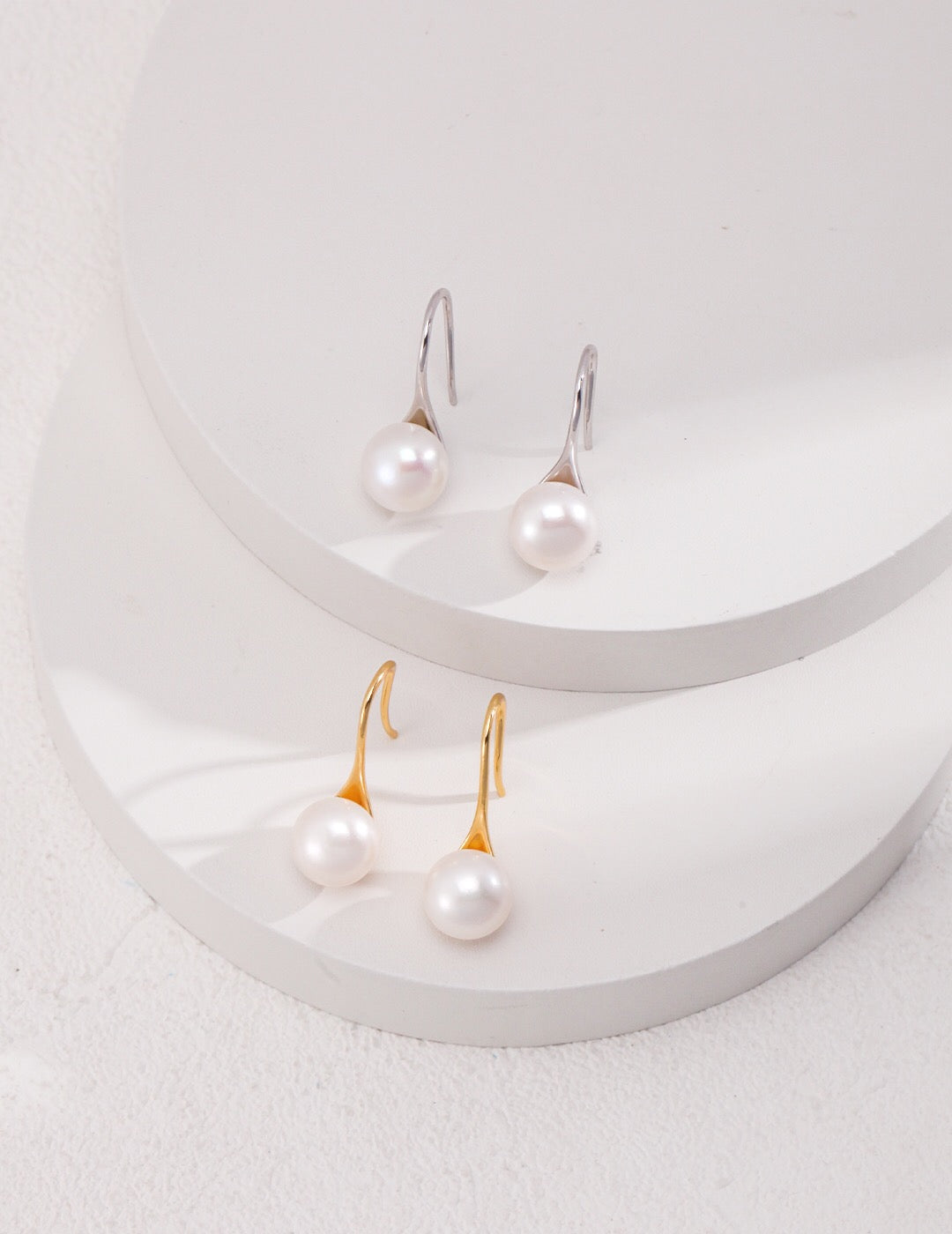 Classic high-heeled pearl dangle earrings featuring natural pearls and sterling silver, elegantly designed for a sophisticated look.