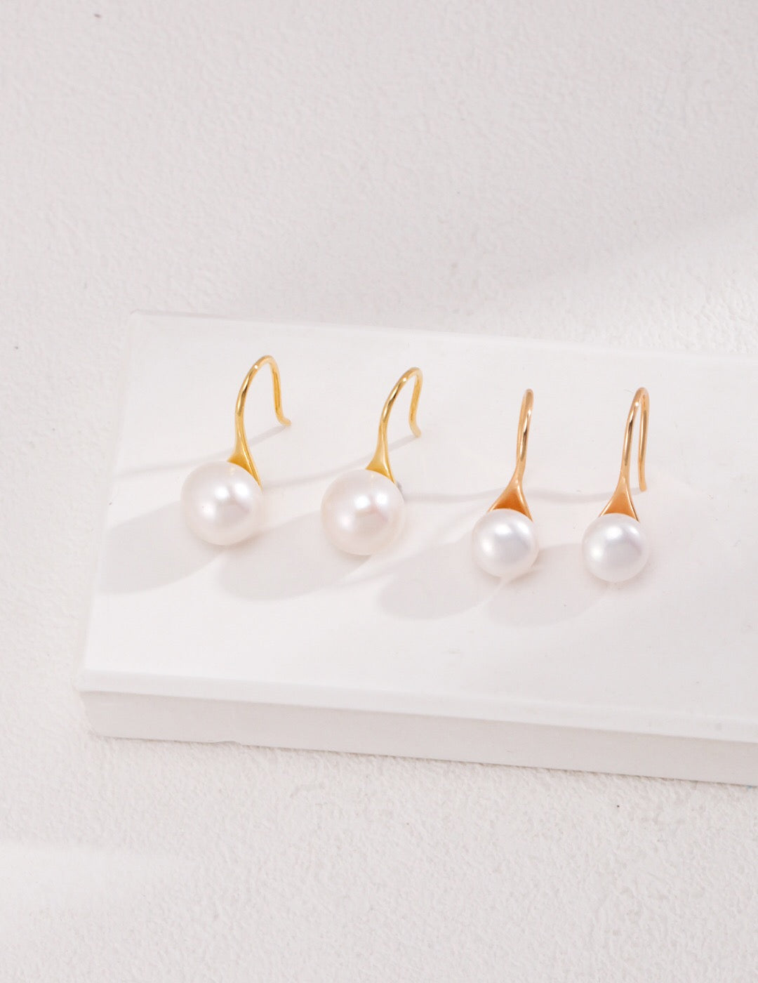 Classic high-heeled pearl dangle earrings featuring natural pearls and sterling silver, elegantly designed for a sophisticated look.