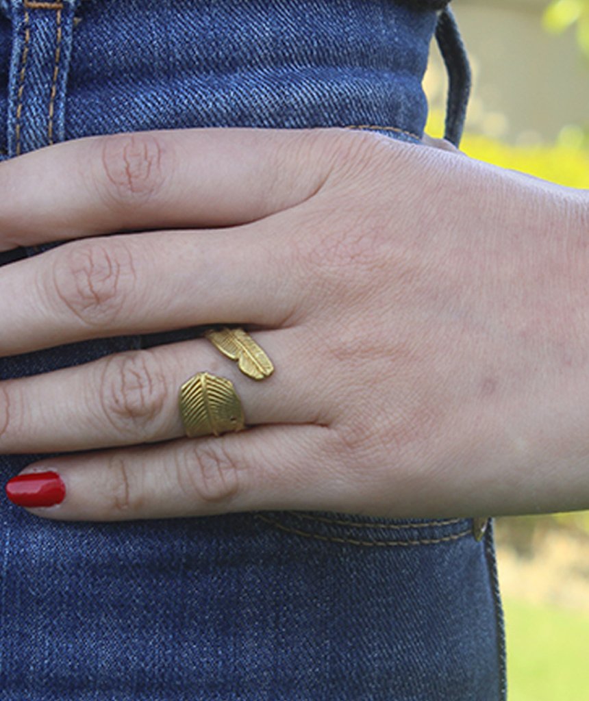 Classic Leaf Ring featuring a tropical leaf design, available in silver and gold, adjustable size for all fingers.