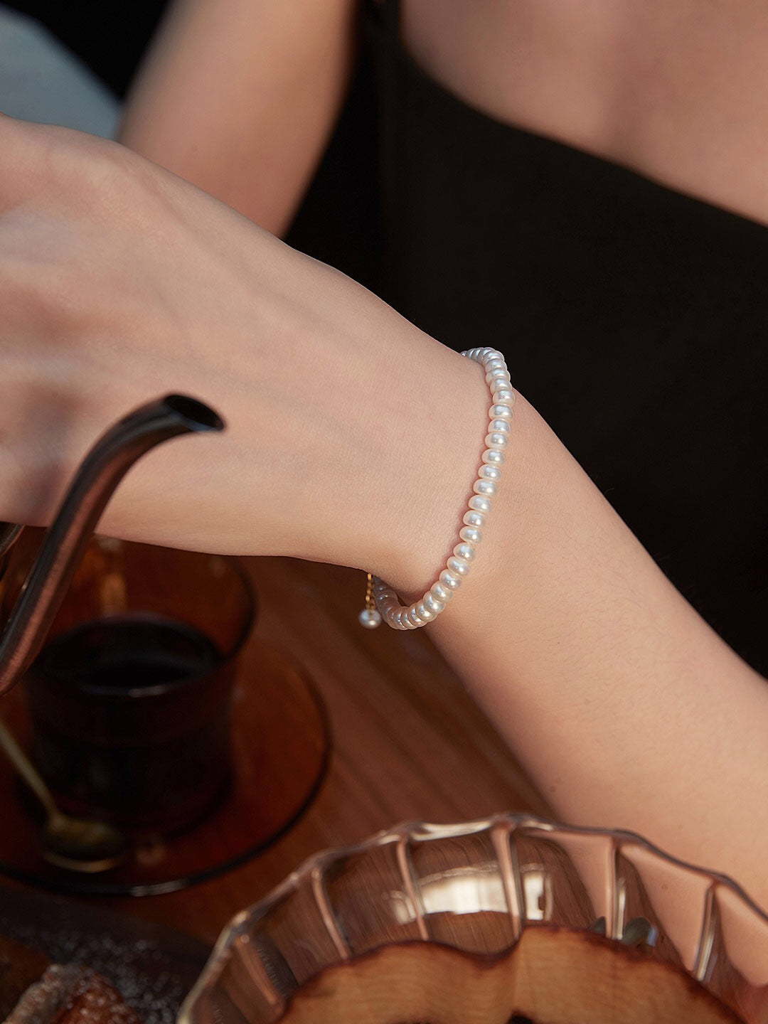 A beautifully handcrafted Classic Natural Pearl Bracelet featuring natural pearls and gold vermeil, elegantly displayed on a soft fabric background.