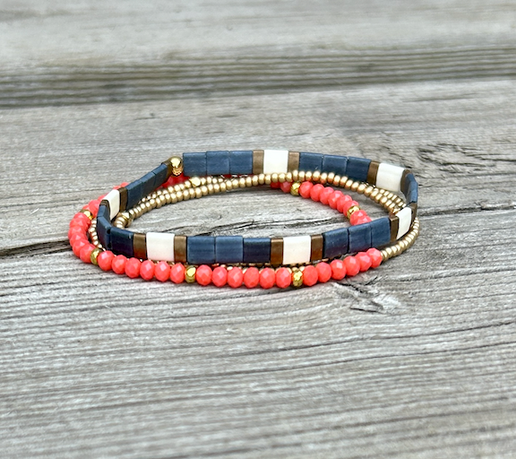 Classic Navy, White & Gold Stretchy Tila Bead Bracelet showcasing elegant design and vibrant colors.