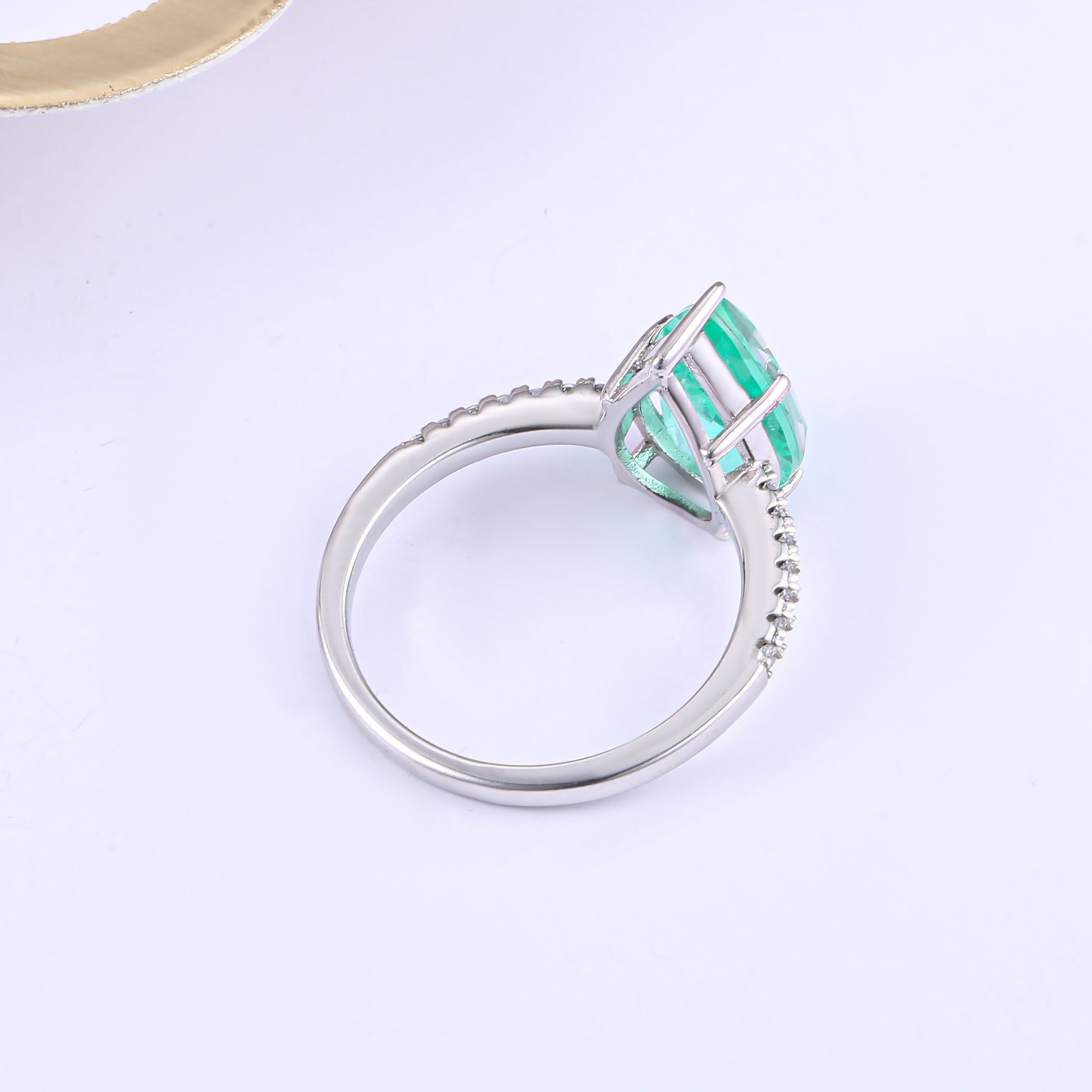 Classic pear shape tourmaline paraiba ring in sterling silver with white gold finish, featuring a vibrant sea blue paraiba stone.