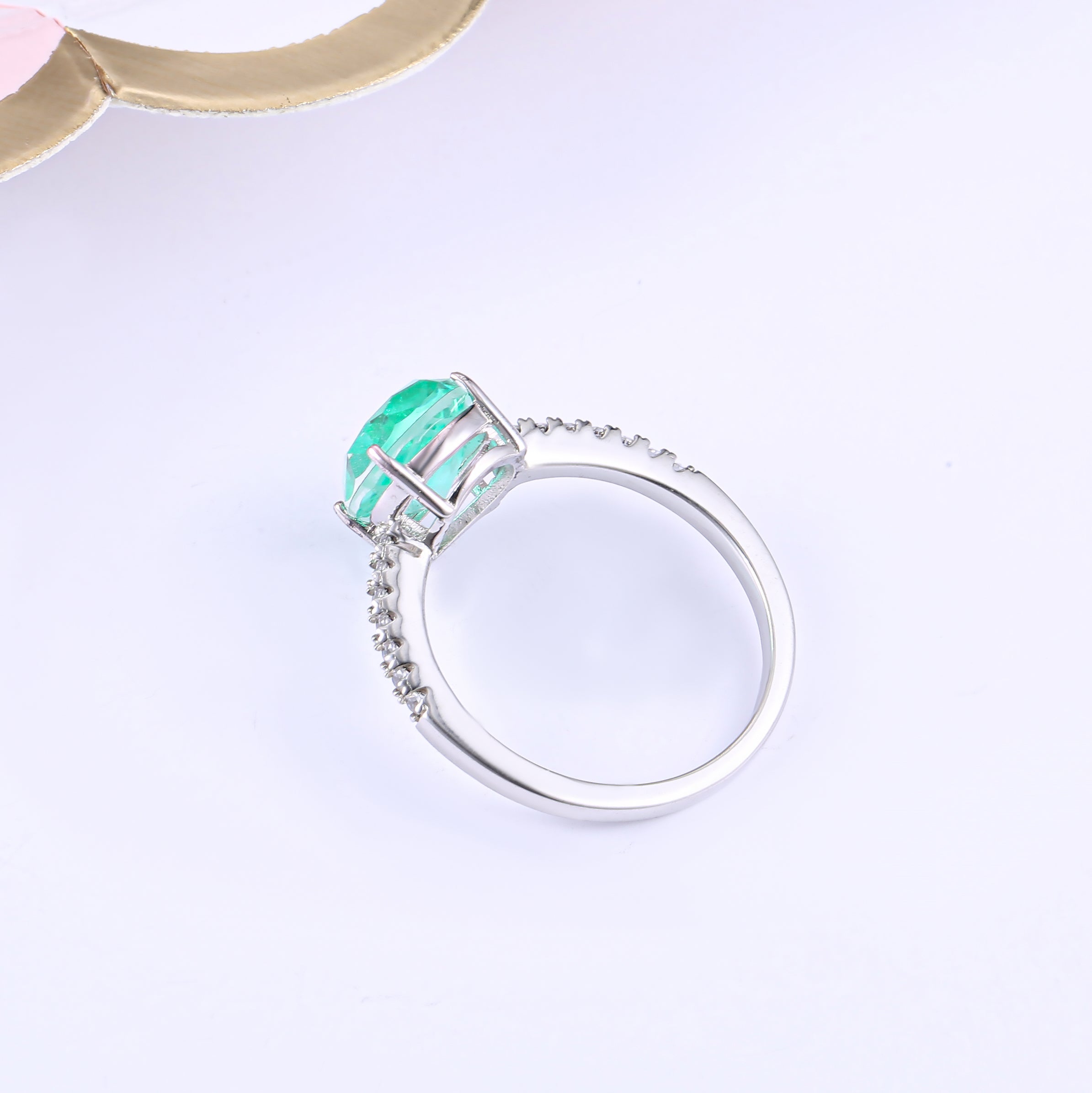 Classic pear shape tourmaline paraiba ring in sterling silver with white gold finish, featuring a vibrant sea blue paraiba stone.