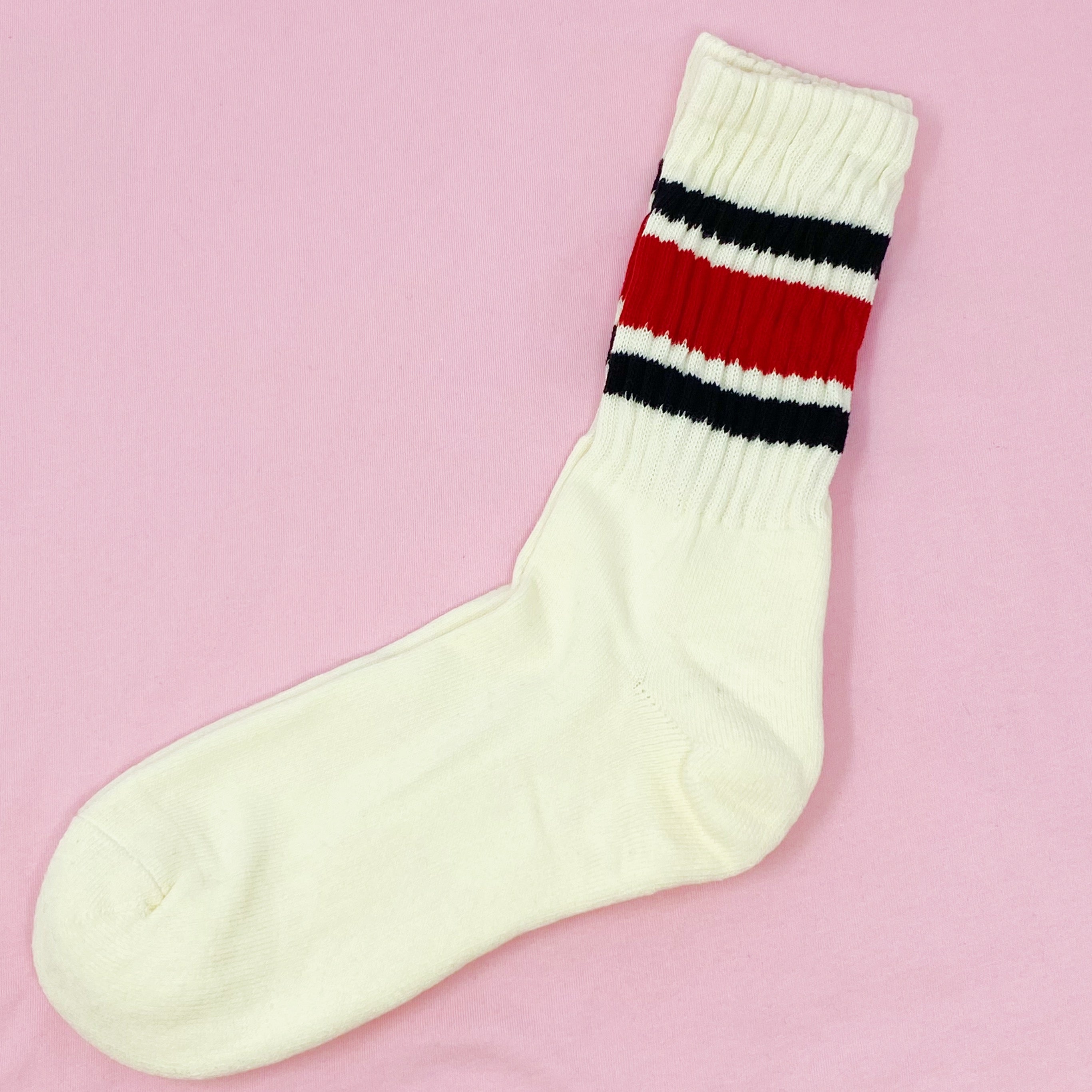 A pair of Classic Striped Socks featuring trendy stripes in vibrant colors, showcasing their comfortable cotton blend material.