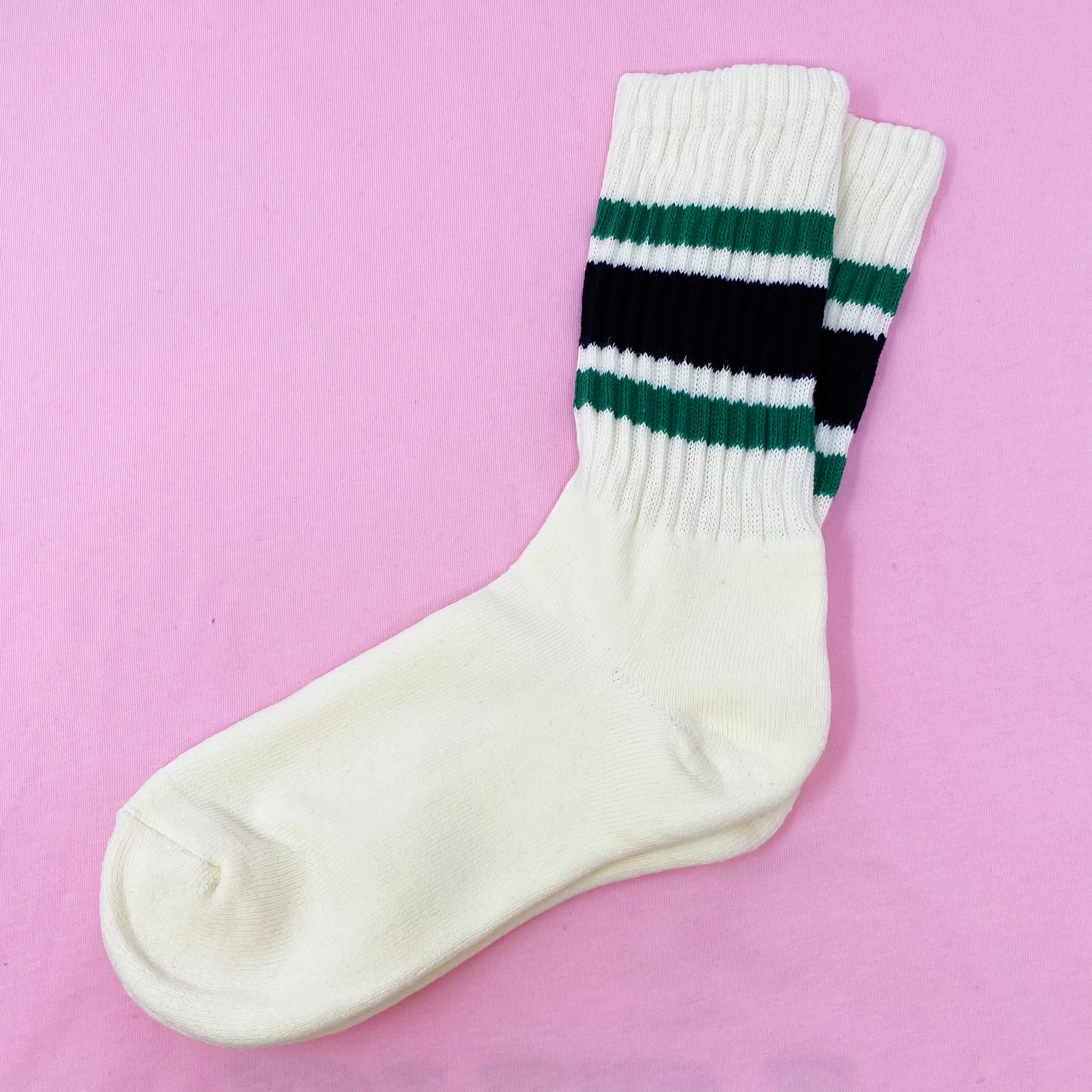 A pair of Classic Striped Socks featuring trendy stripes in vibrant colors, showcasing their comfortable cotton blend material.