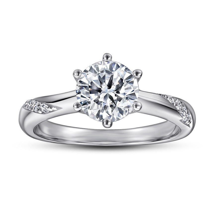 A stunning classic engagement ring made of 925 sterling silver with a white gold finish, featuring a brilliant white sapphire centerpiece.