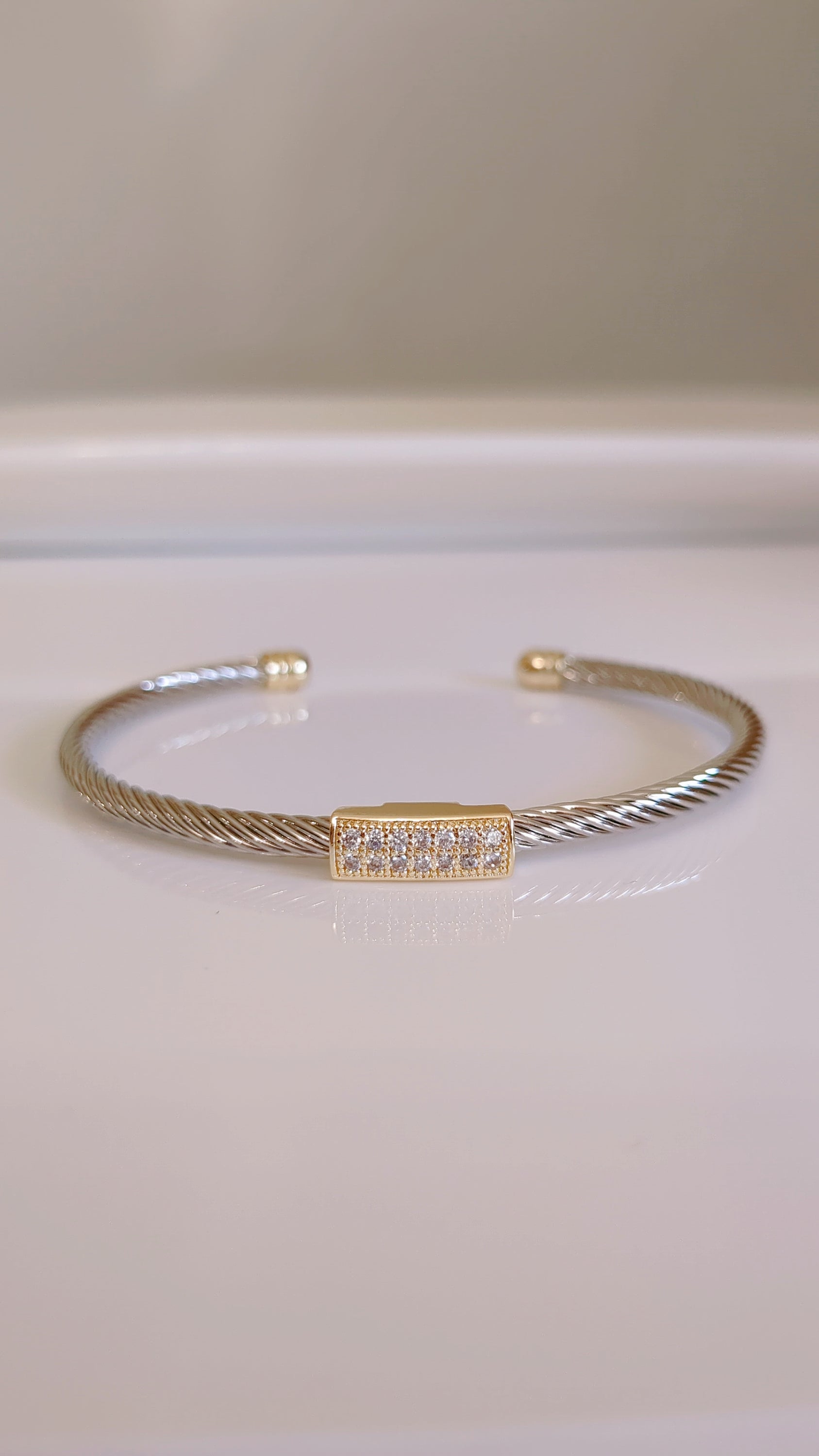 A stylish Classy Bracelet featuring a delicate cable pattern and simulated diamonds, crafted from stainless steel with rhodium plating.