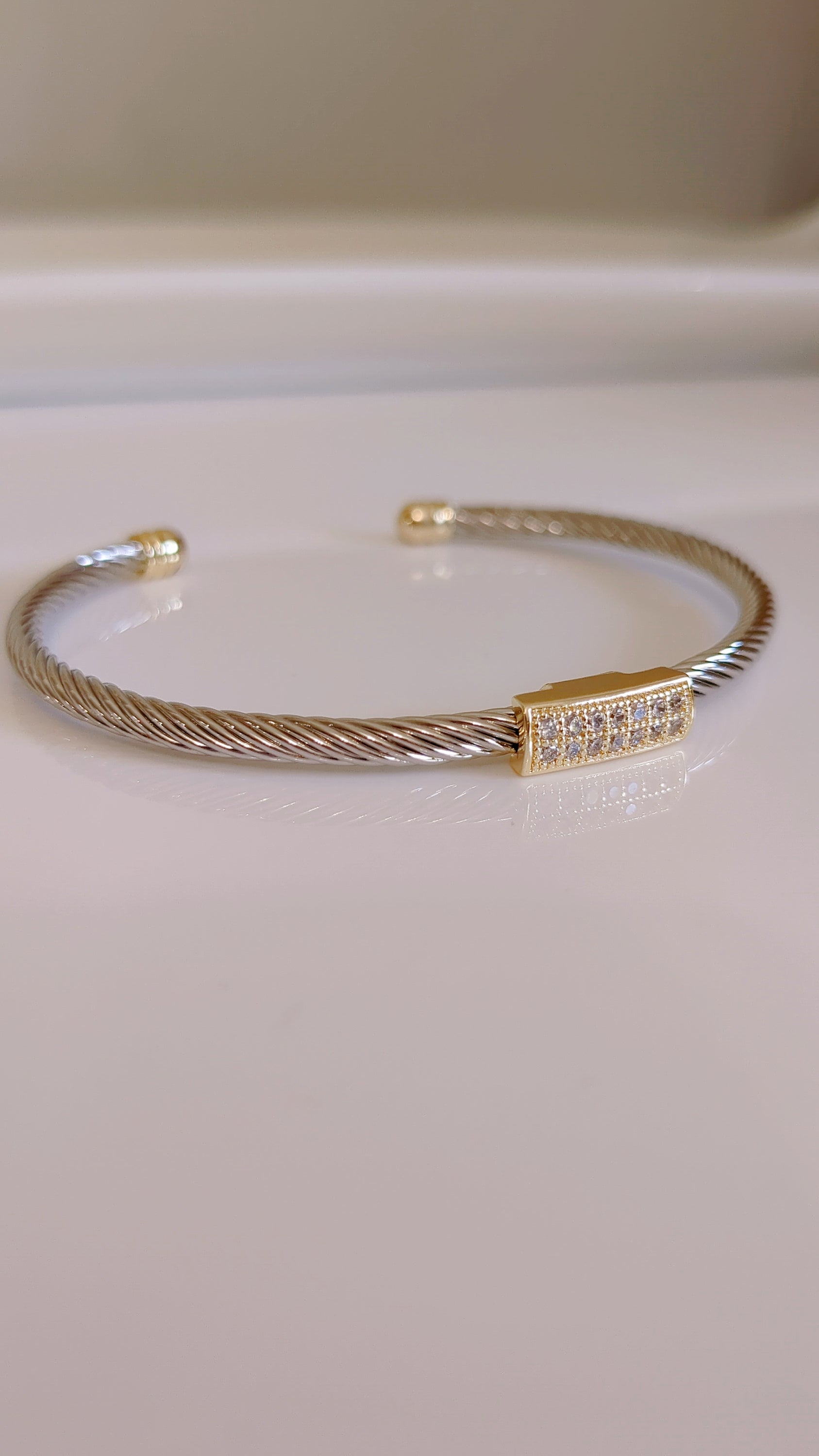 A stylish Classy Bracelet featuring a delicate cable pattern and simulated diamonds, crafted from stainless steel with rhodium plating.