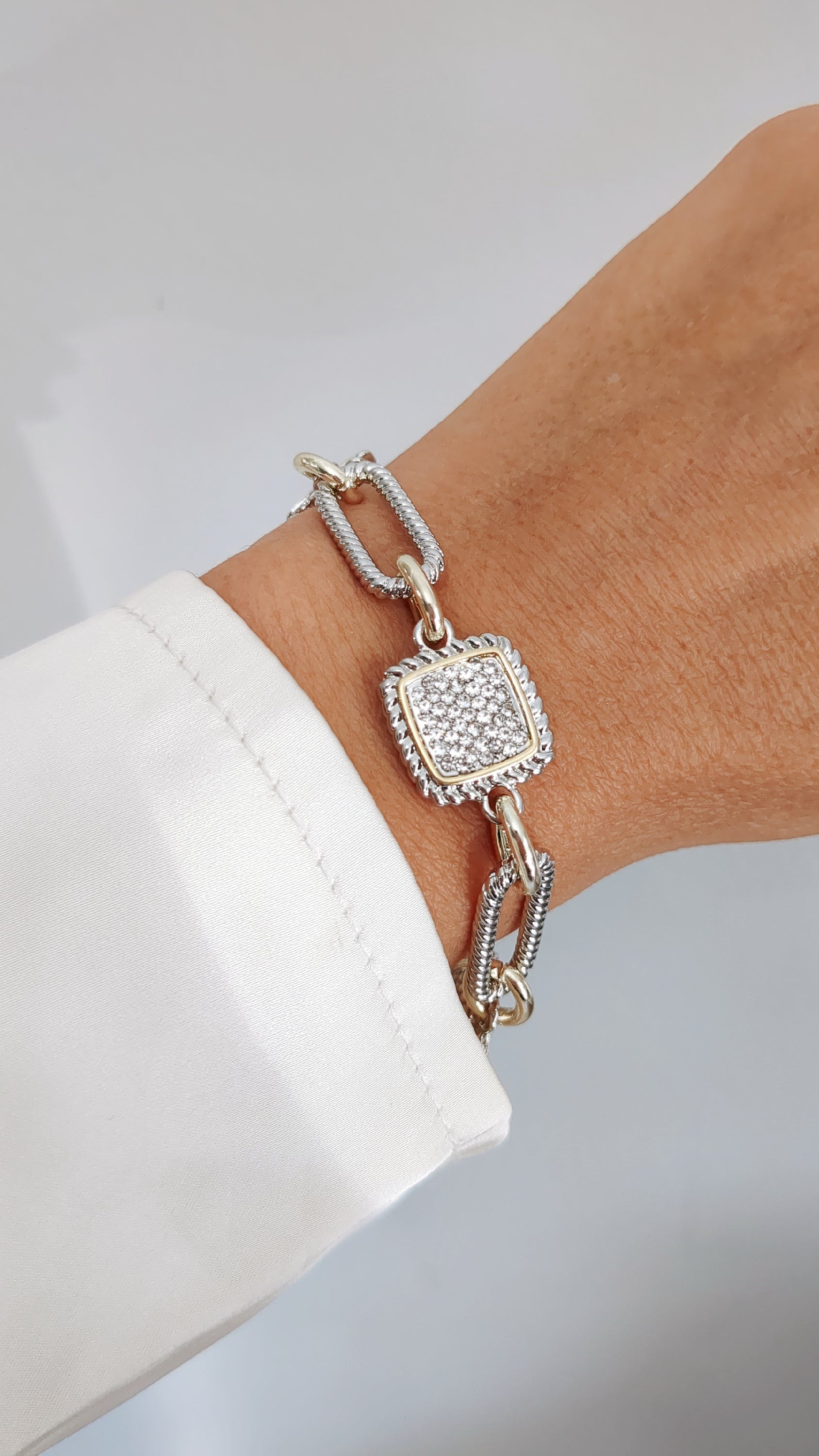 A stylish Classy Cable Bracelet featuring a delicate cable pattern, made from stainless steel with rhodium plating, perfect for stacking or everyday wear.