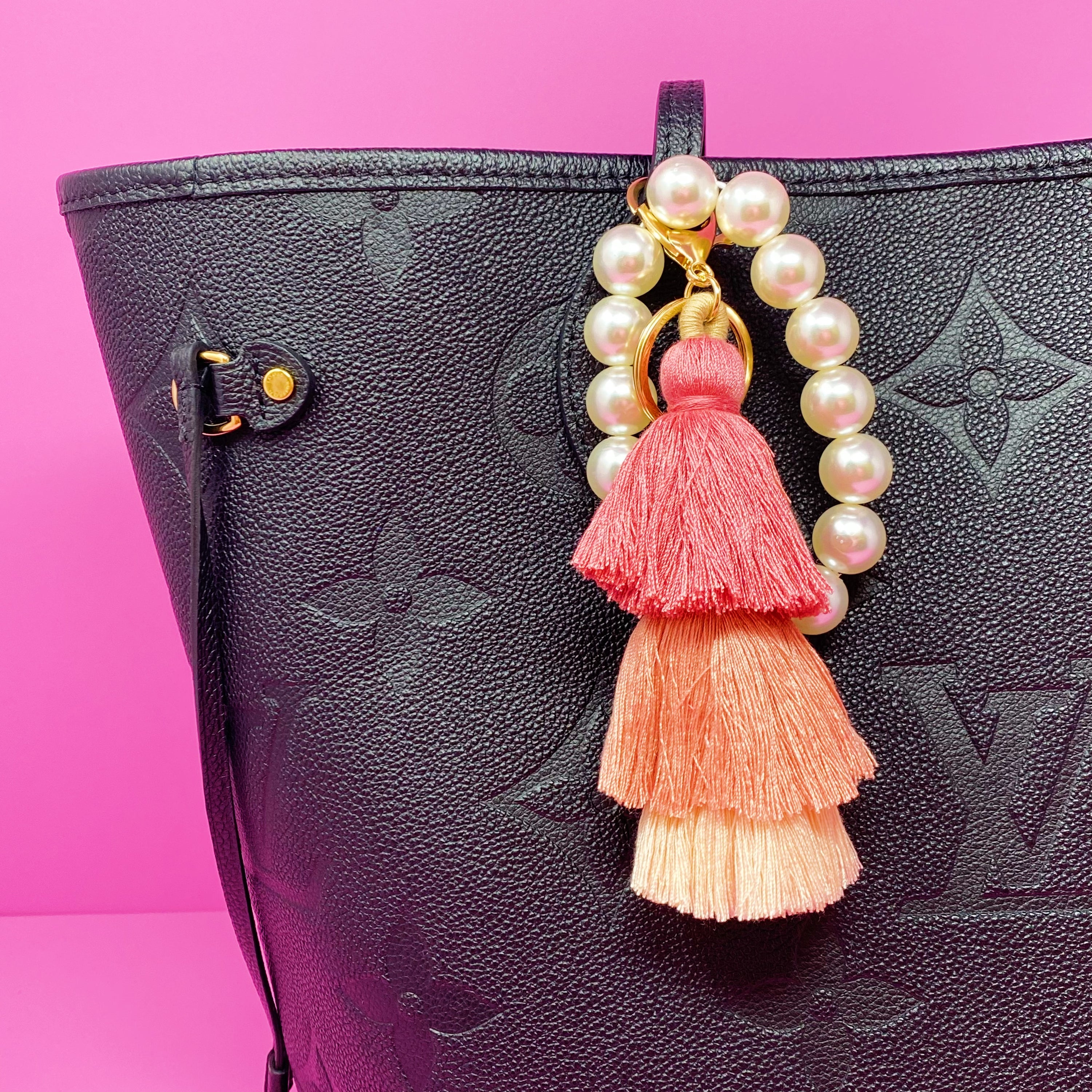 Classy Girl Pearl Tassel Key Chain featuring a large pearl bead handle and a chic 3-tier tassel drop with gold hardware.