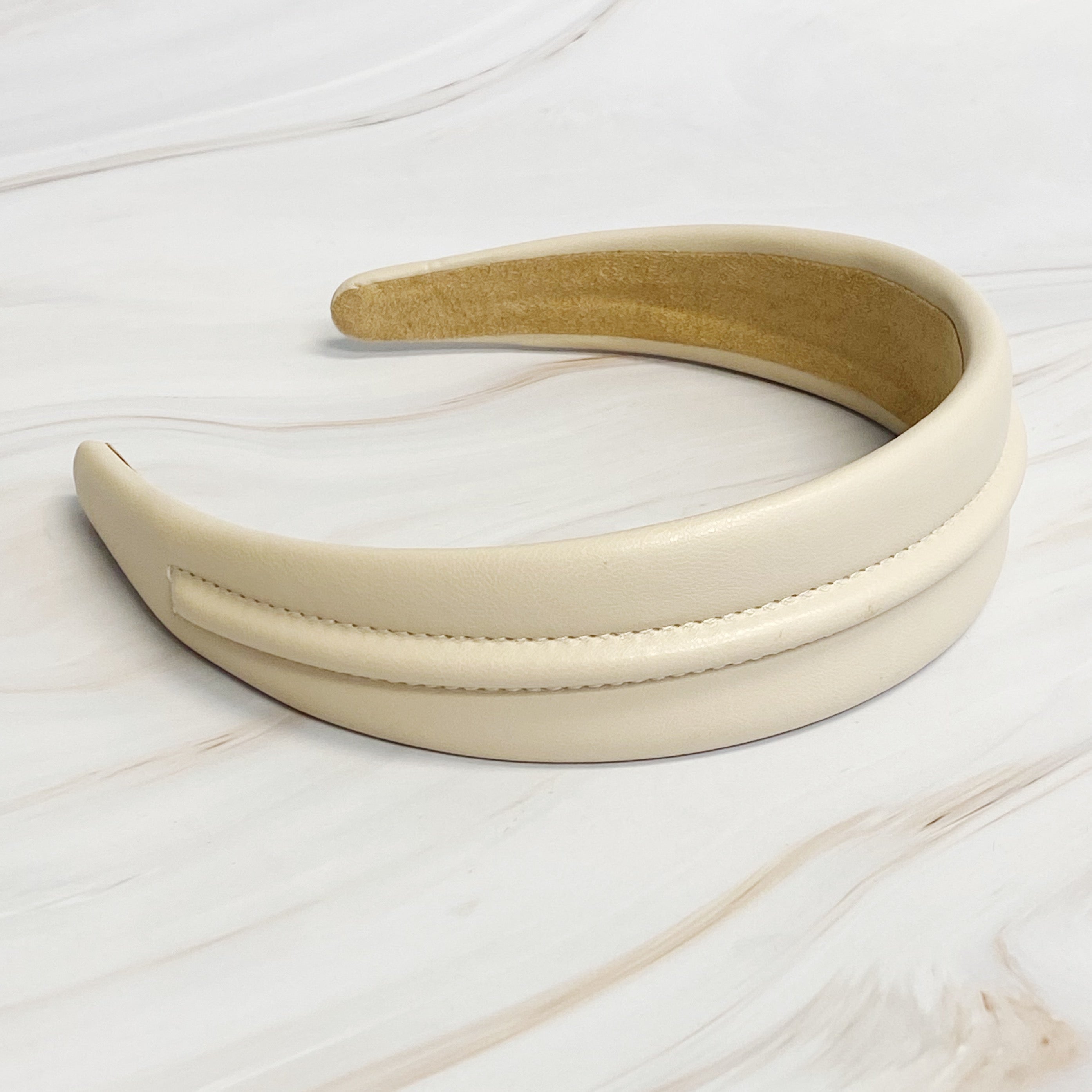 Classy Vegan Leather Headband in sleek design, showcasing soft edges and high-quality faux leather material.