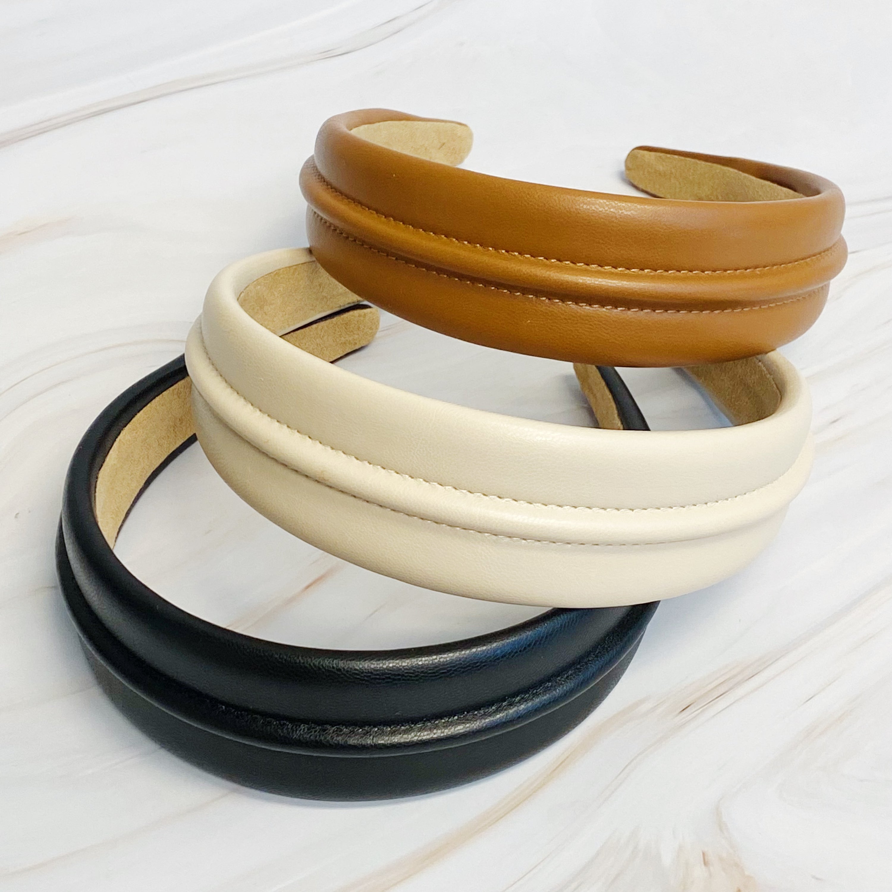 Classy Vegan Leather Headband in sleek design, showcasing soft edges and high-quality faux leather material.