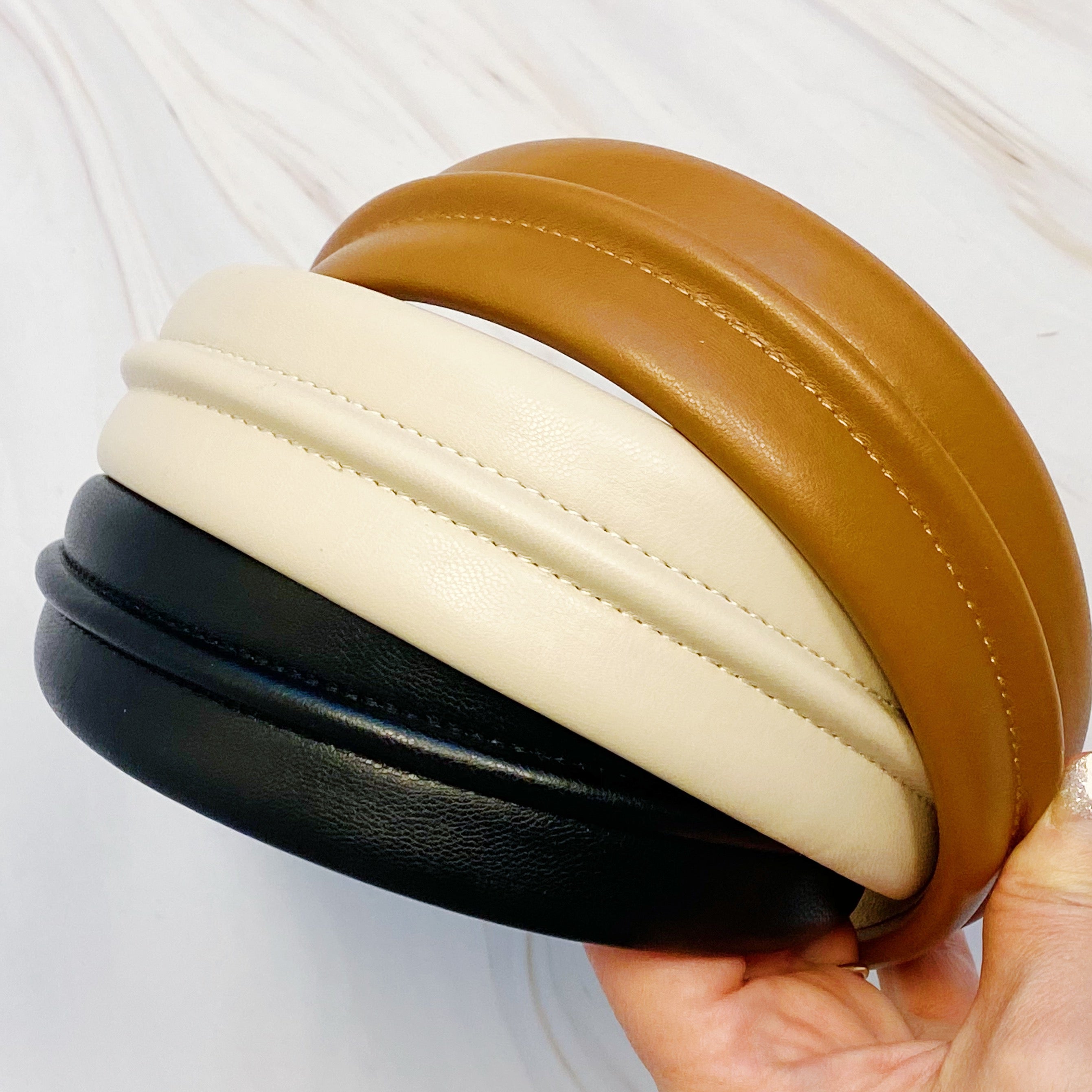 Classy Vegan Leather Headband in sleek design, showcasing soft edges and high-quality faux leather material.