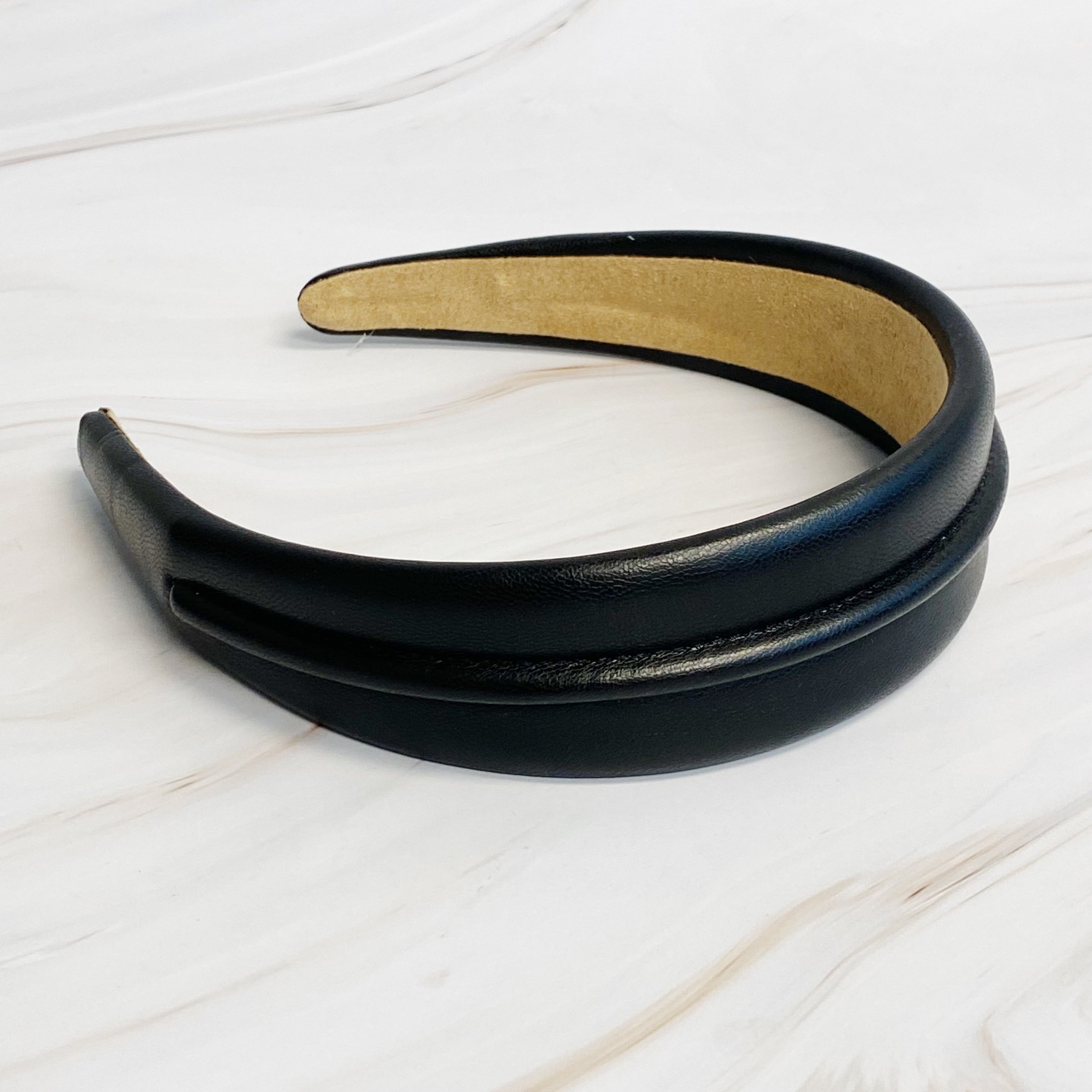 Classy Vegan Leather Headband in sleek design, showcasing soft edges and high-quality faux leather material.