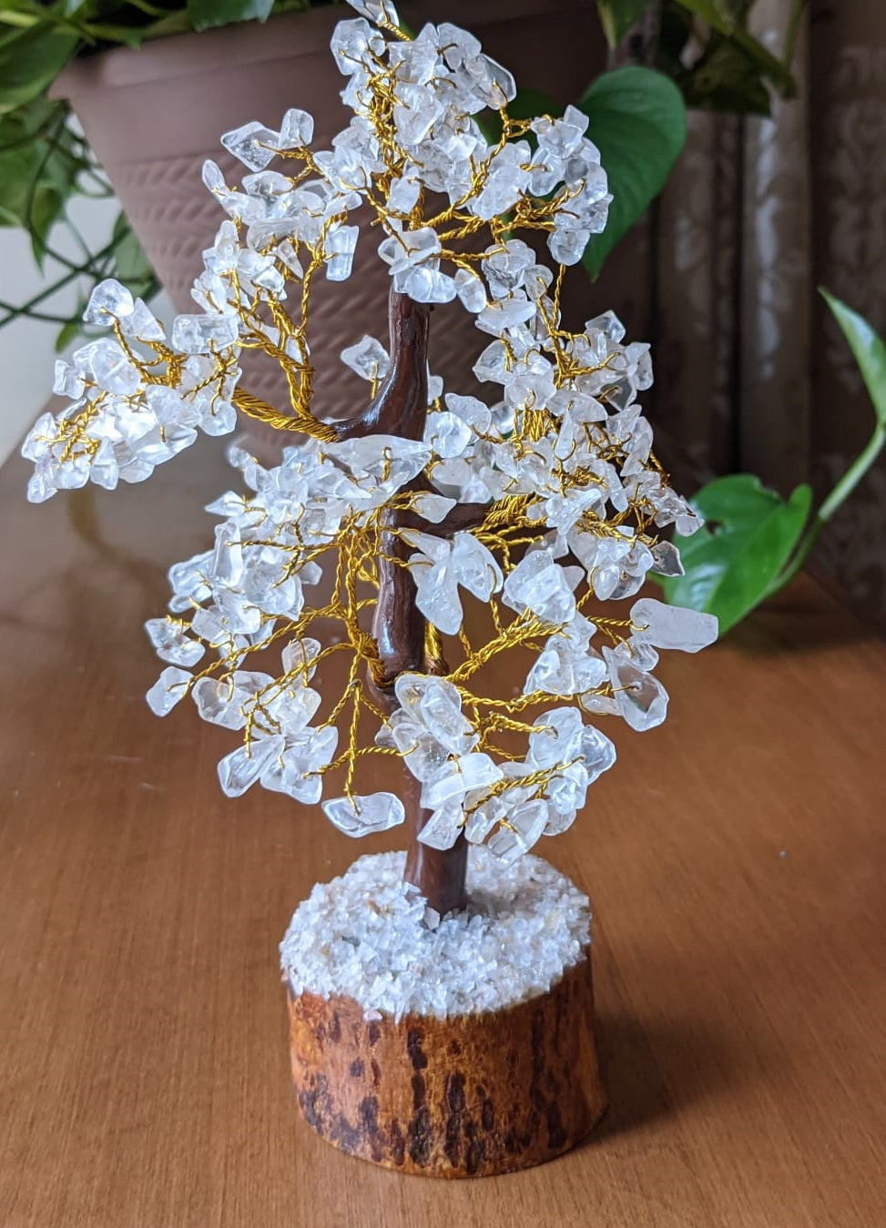 A beautifully handcrafted Clear Quartz Gemstone Tree featuring 300 natural quartz chips on a sturdy wooden base, standing 8-9 inches tall.