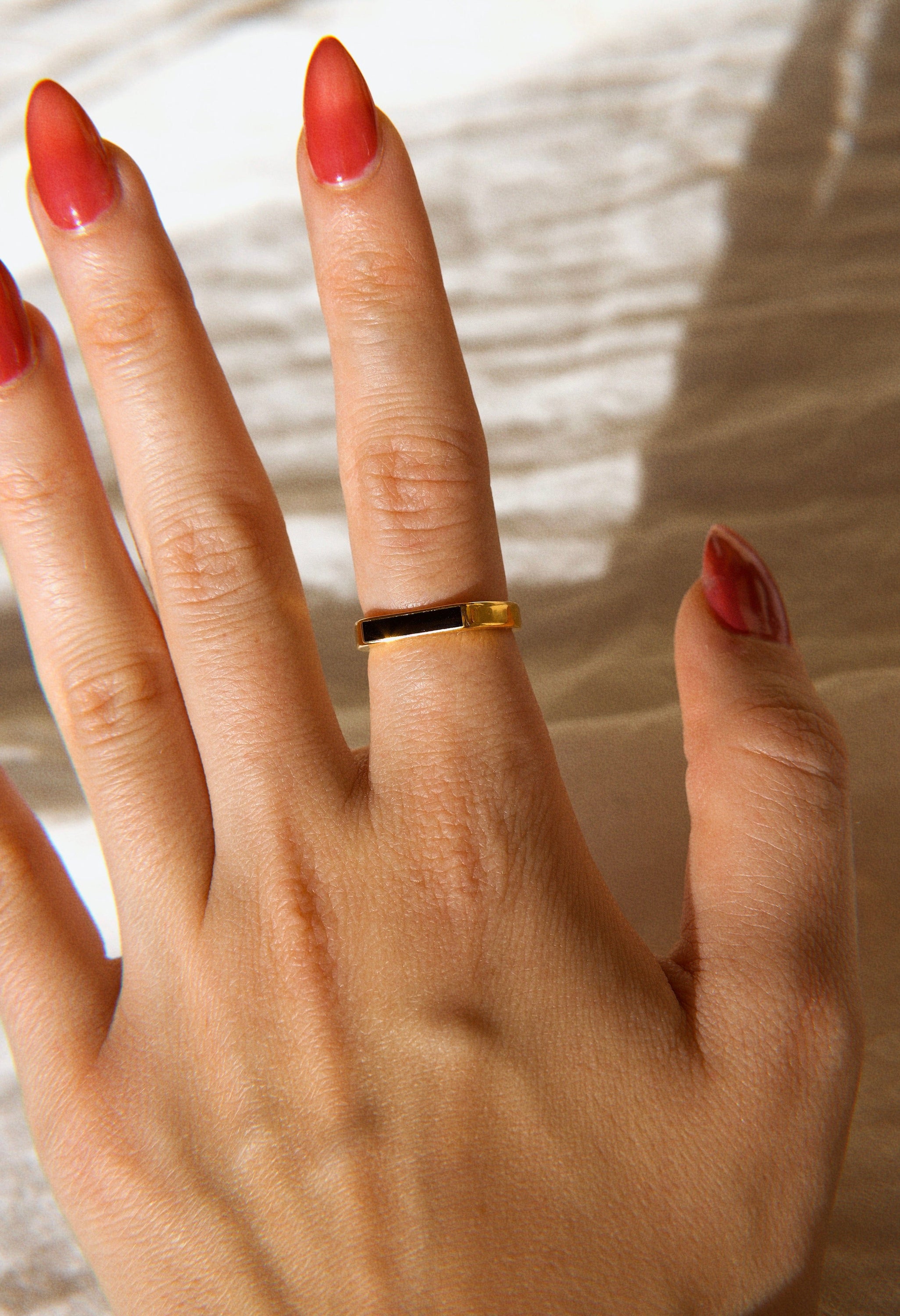 Clementine Dainty Signet Ring featuring black enamel and mother of pearl, set in 18k gold plated stainless steel.