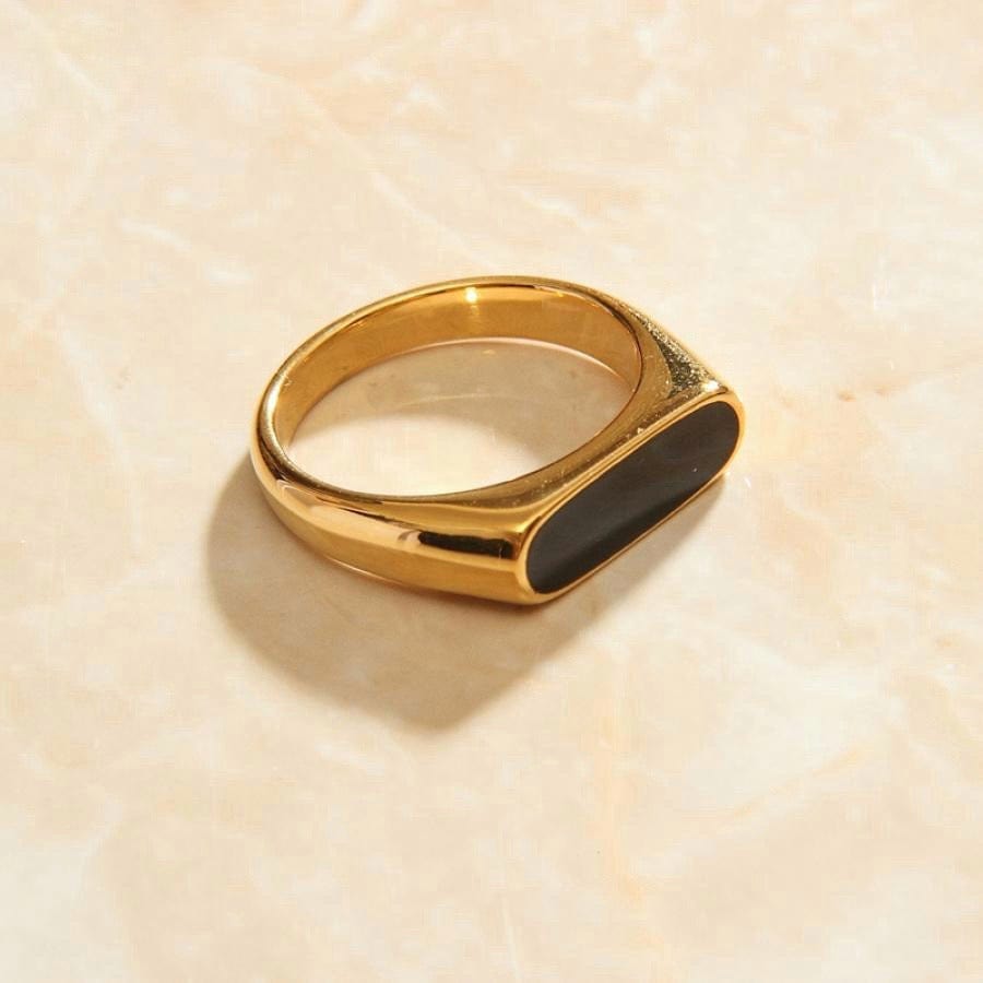 Clementine Thin Signet Enamel Ring featuring a minimalist geometric design with black enamel stone and 18k gold plated stainless steel.