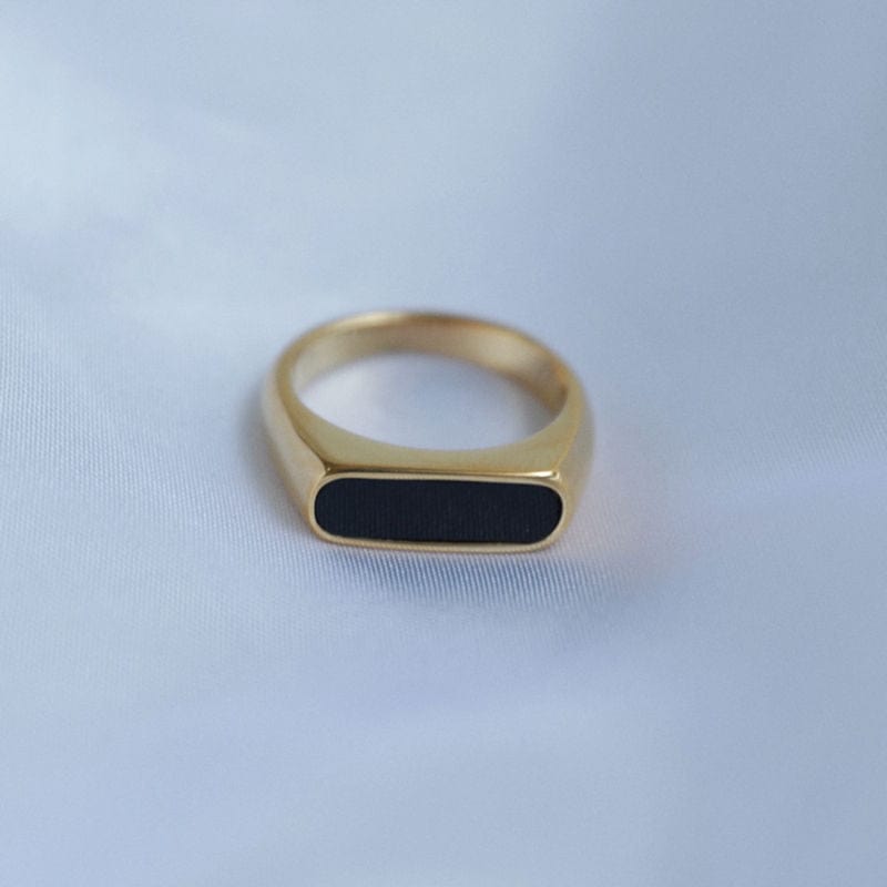 Clementine Thin Signet Enamel Ring featuring a minimalist geometric design with black enamel stone and 18k gold plated stainless steel.