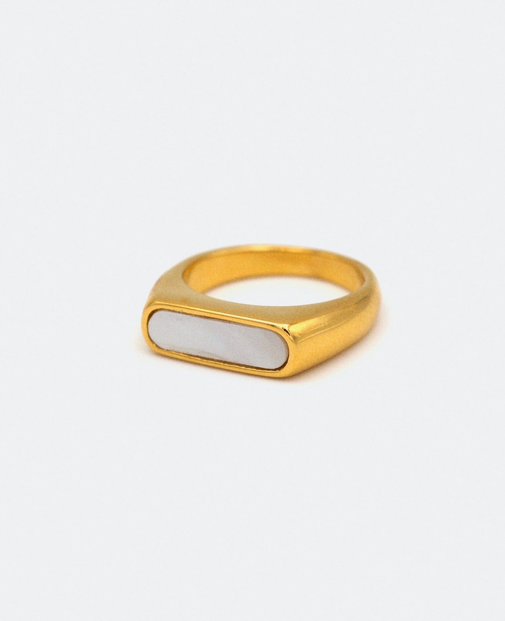 Clementine Thin Signet Shell Ring featuring 18k gold plated stainless steel and natural white shell stone, showcasing a minimalist geometric design.