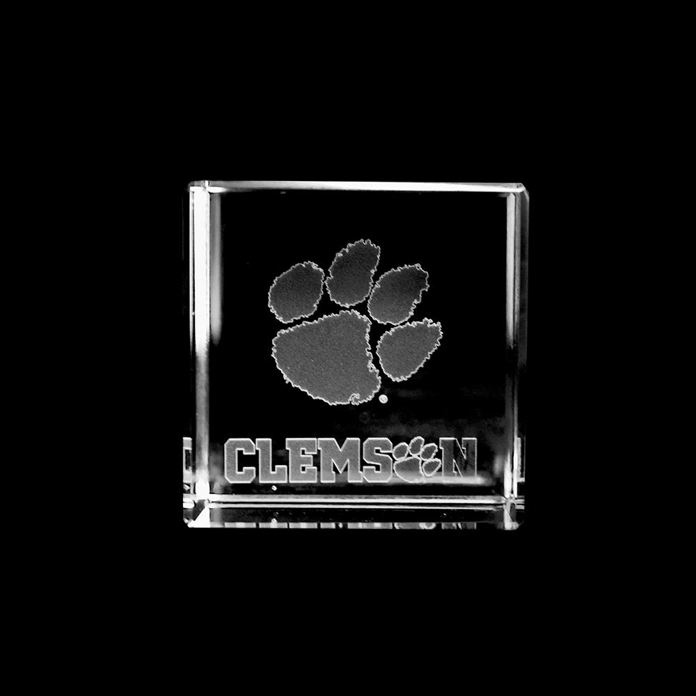 Clemson Paw Cube made of optical crystal featuring the Clemson logo inside, showcasing sharp cut angles and vibrant reflections.