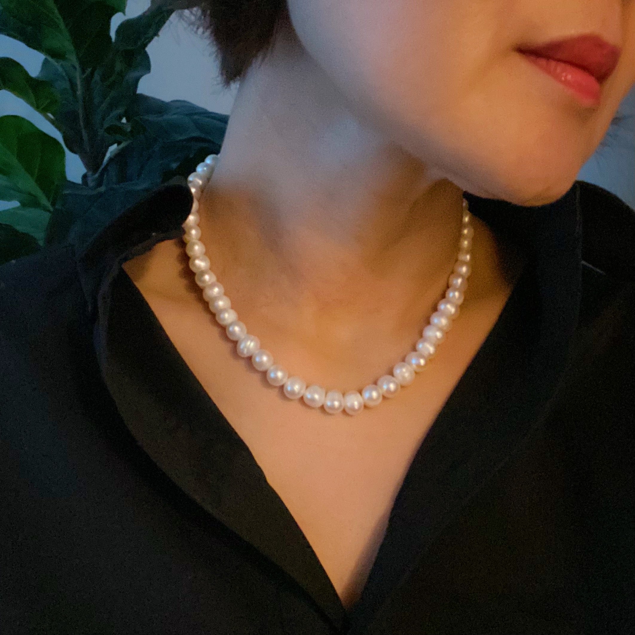 Clover Clasp Genuine Pearl Necklace featuring freshwater pearls in various sizes and an elegant 18k gold dipped sterling silver clasp.