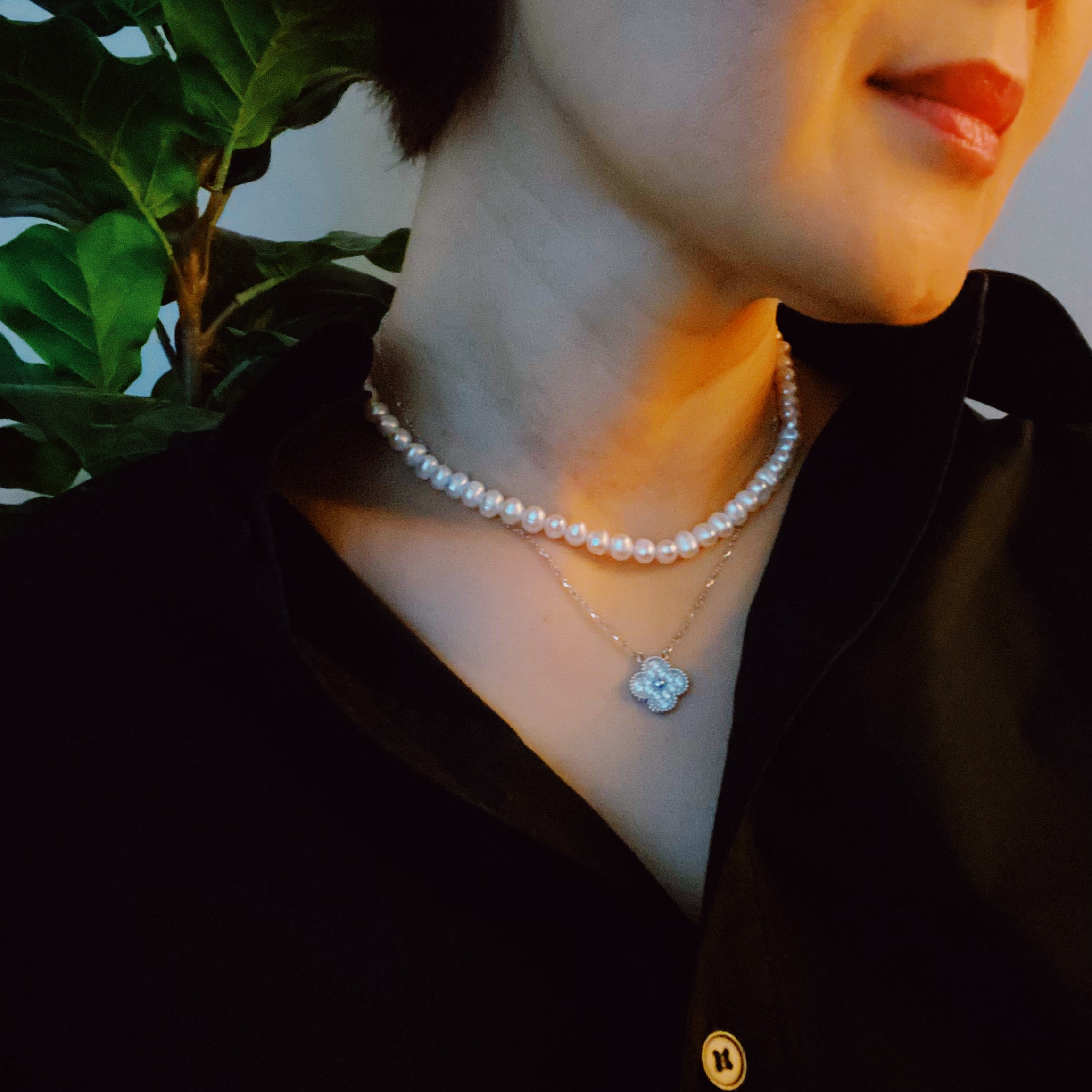 Clover Clasp Genuine Pearl Necklace featuring freshwater pearls in various sizes and an elegant 18k gold dipped sterling silver clasp.