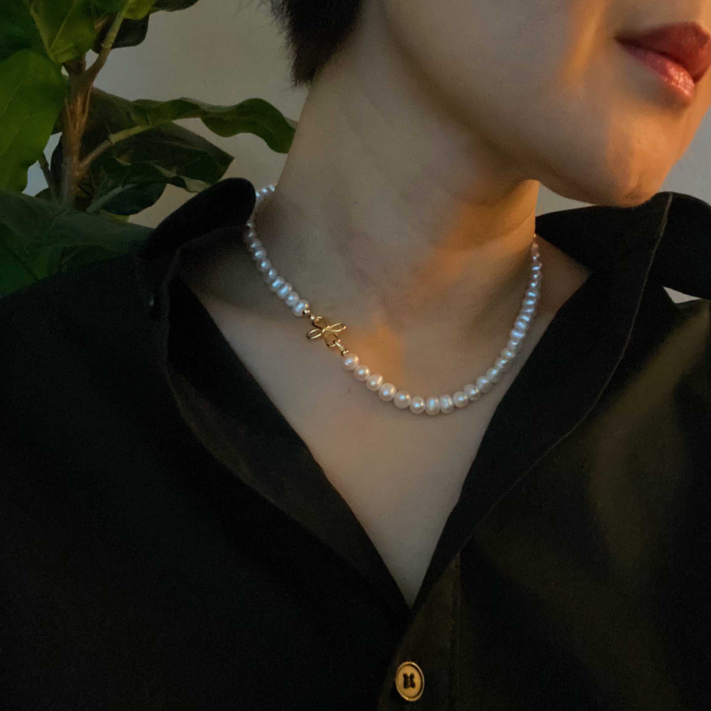 Clover Clasp Genuine Pearl Necklace featuring freshwater pearls in various sizes and an elegant 18k gold dipped sterling silver clasp.