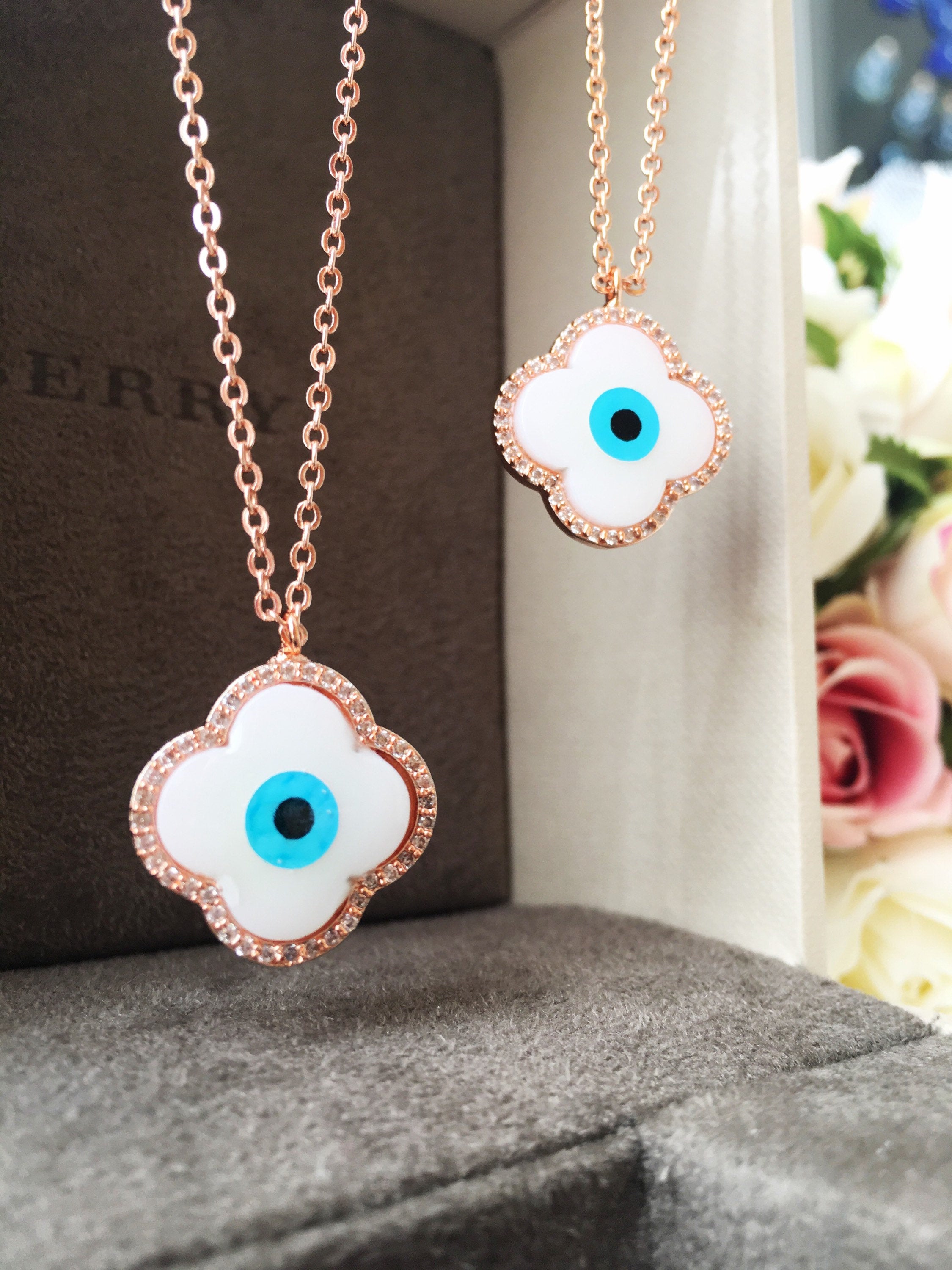 Handmade Clover Evil Eye Necklace featuring a mother of pearl charm and rose gold plating, adjustable chain length.