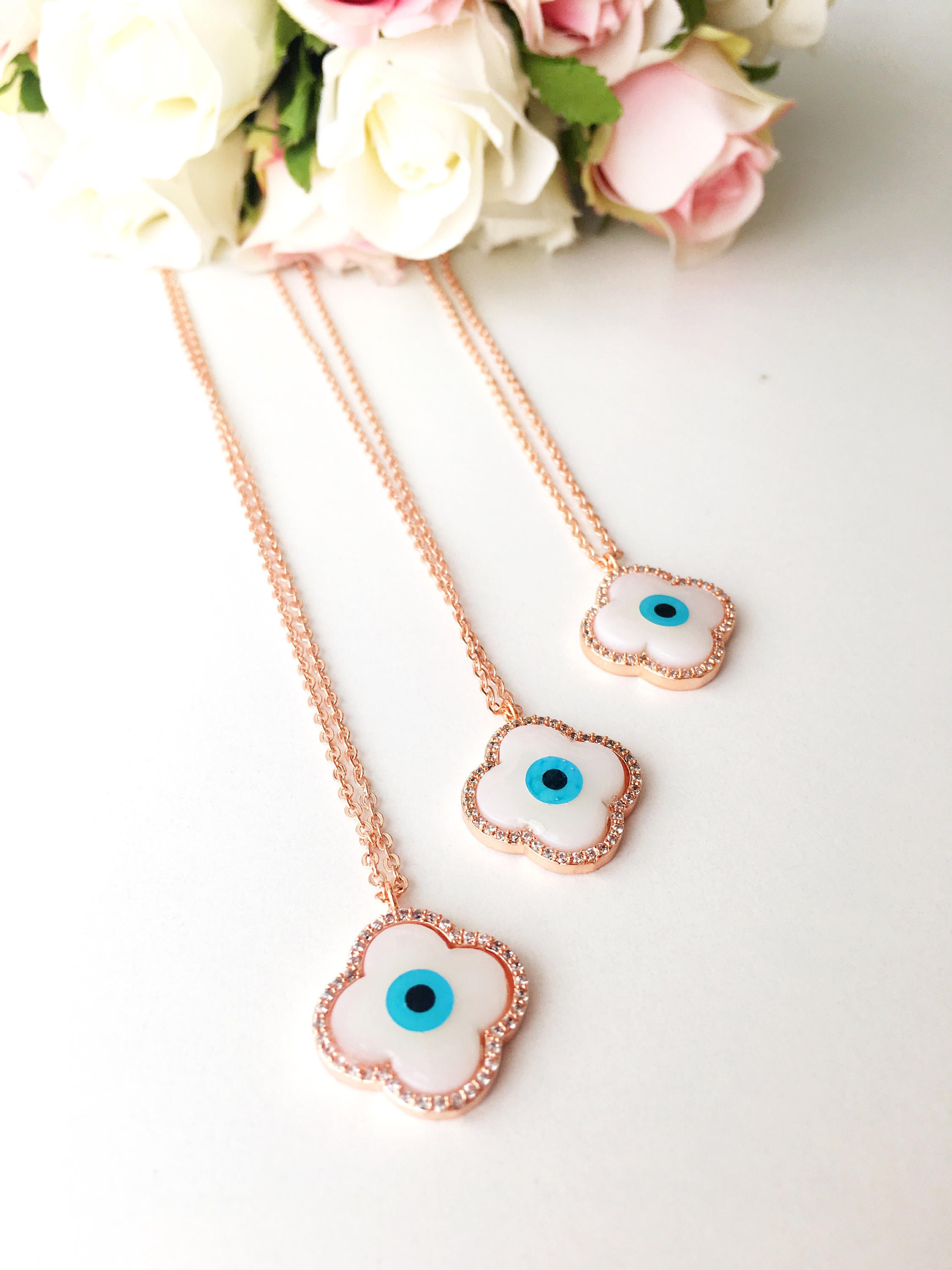 Handmade Clover Evil Eye Necklace featuring a mother of pearl charm and rose gold plating, adjustable chain length.