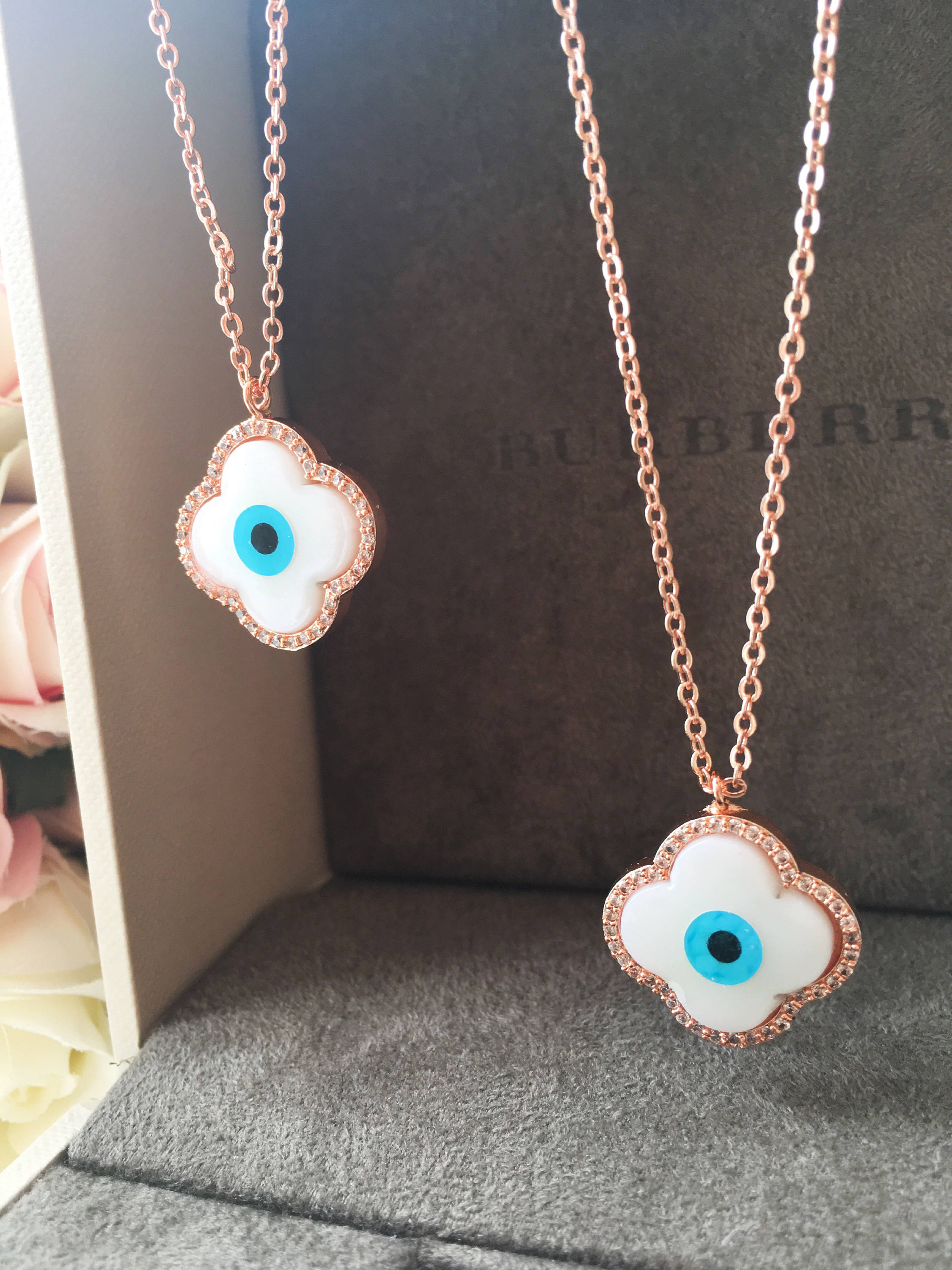 Handmade Clover Evil Eye Necklace featuring a mother of pearl charm and rose gold plating, adjustable chain length.