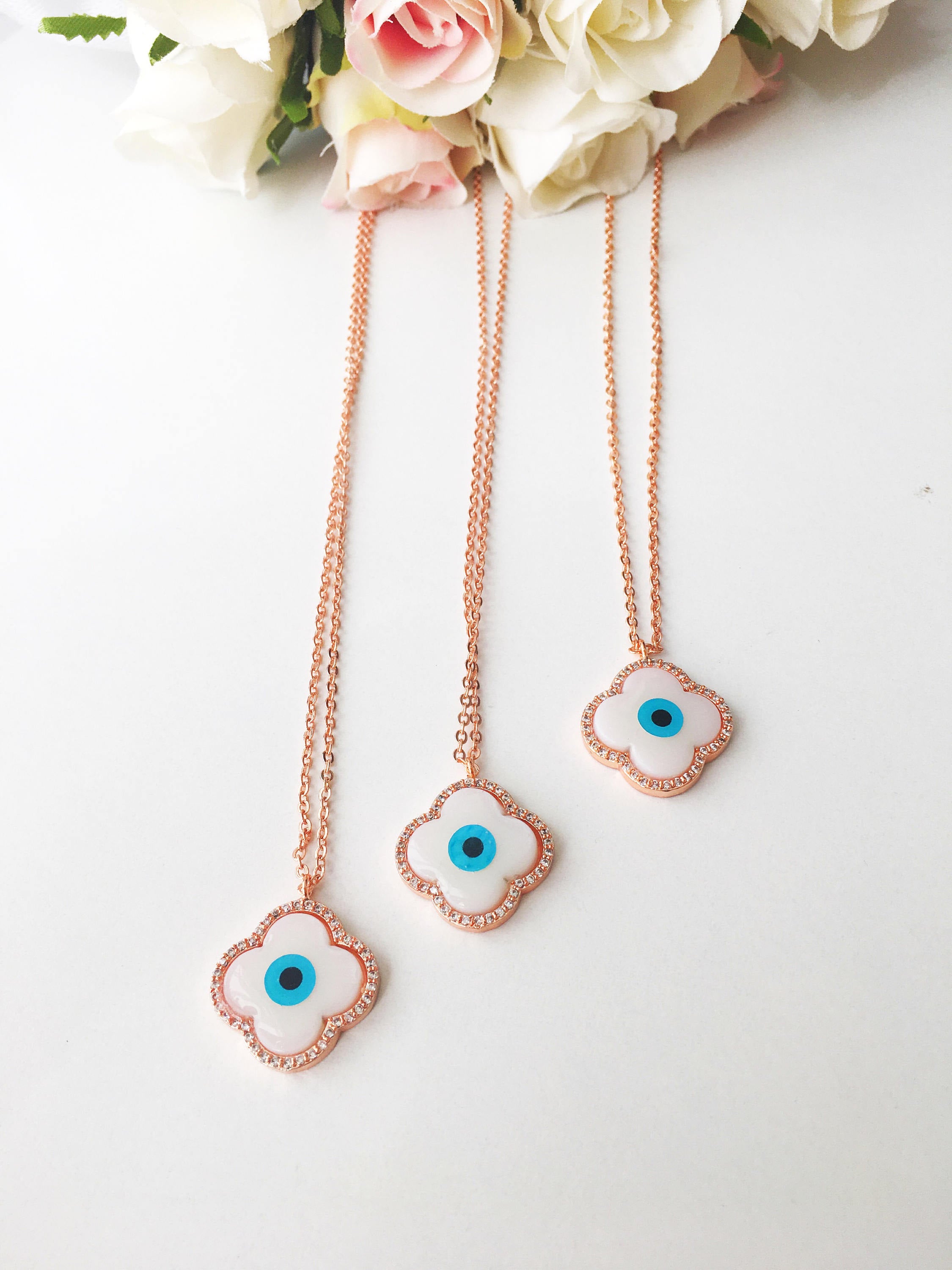 Handmade Clover Evil Eye Necklace featuring a mother of pearl charm and rose gold plating, adjustable chain length.