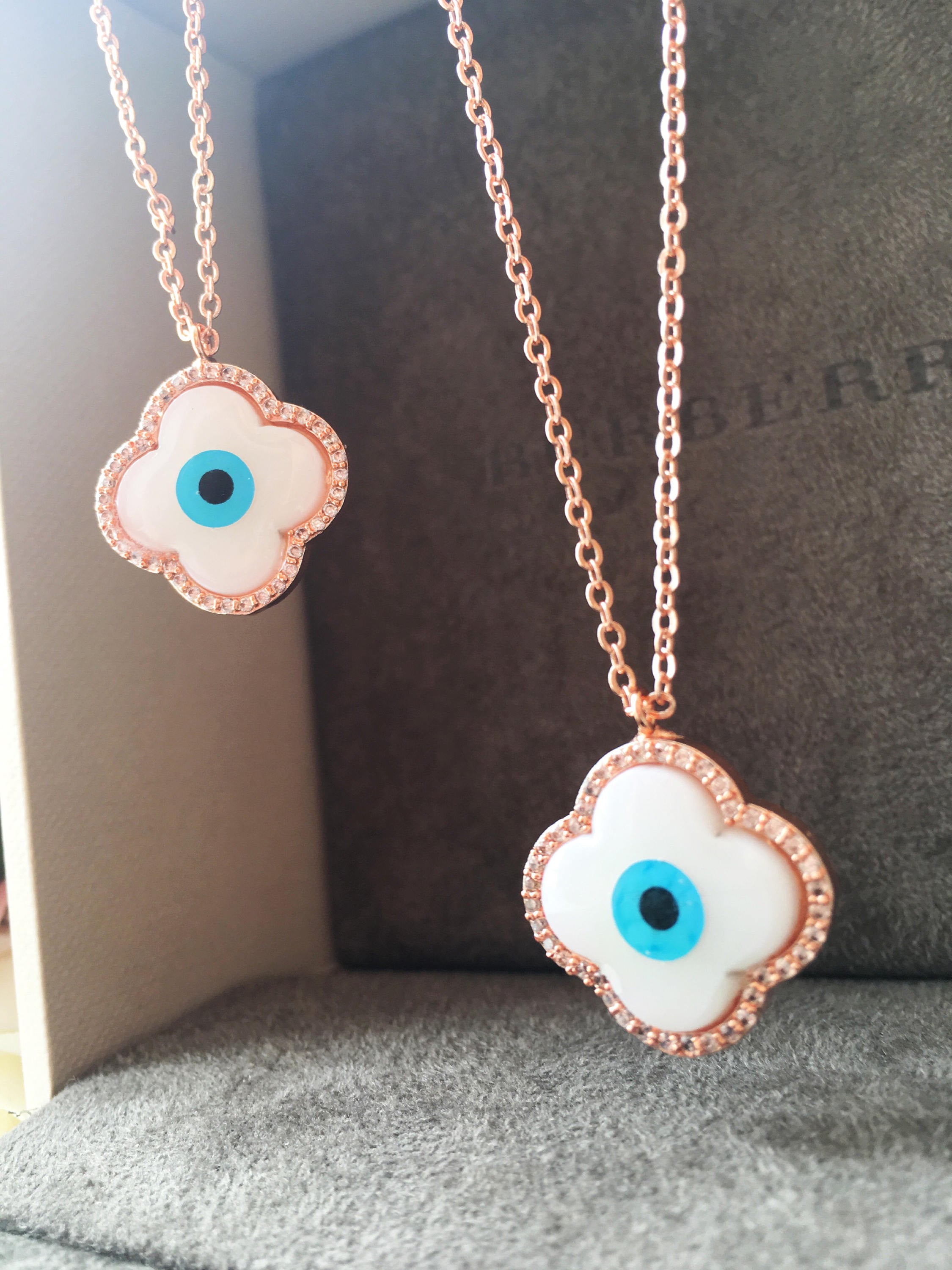 Handmade Clover Evil Eye Necklace featuring a mother of pearl charm and rose gold plating, adjustable chain length.