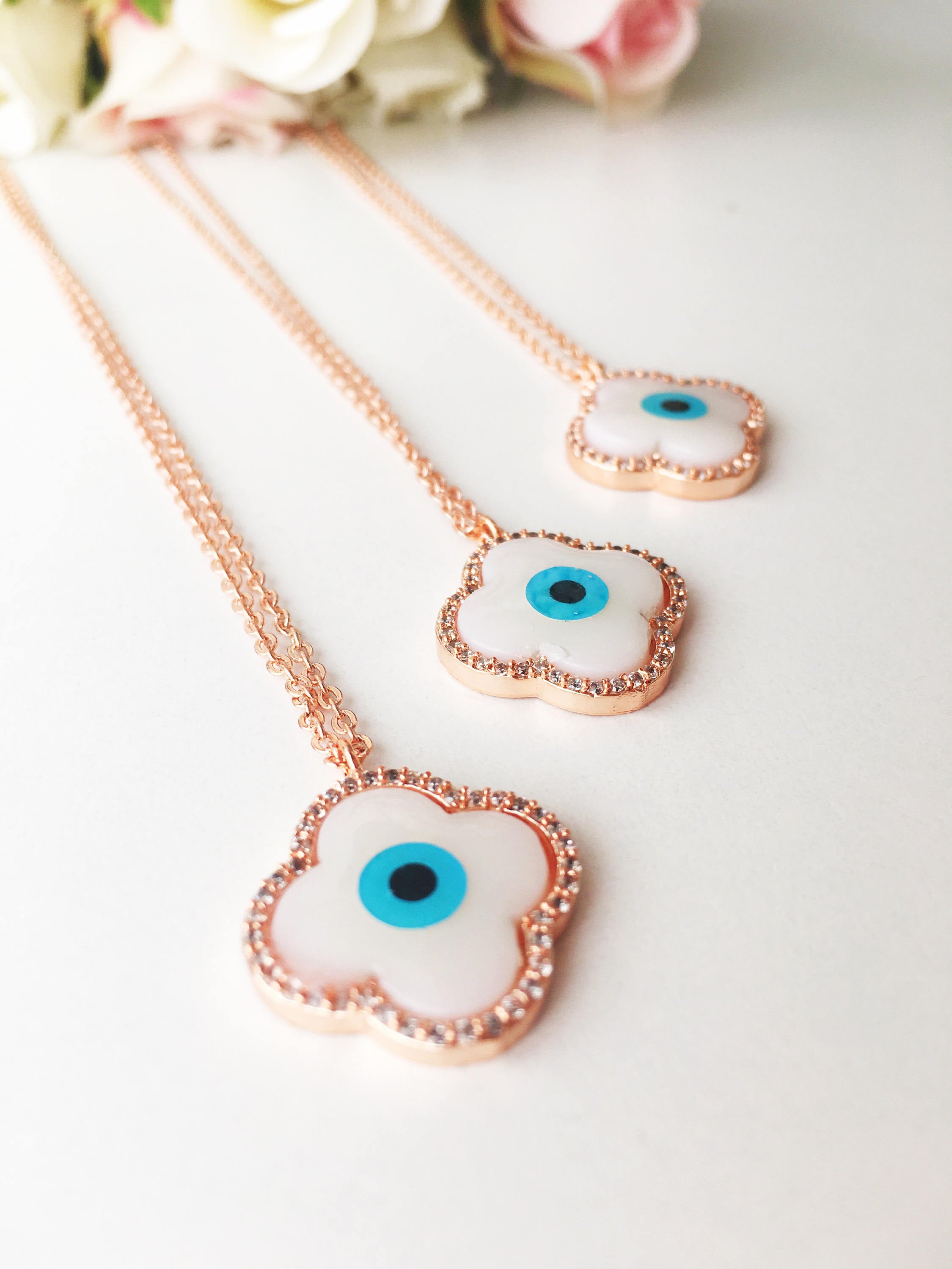 Handmade Clover Evil Eye Necklace featuring a mother of pearl charm and rose gold plating, adjustable chain length.