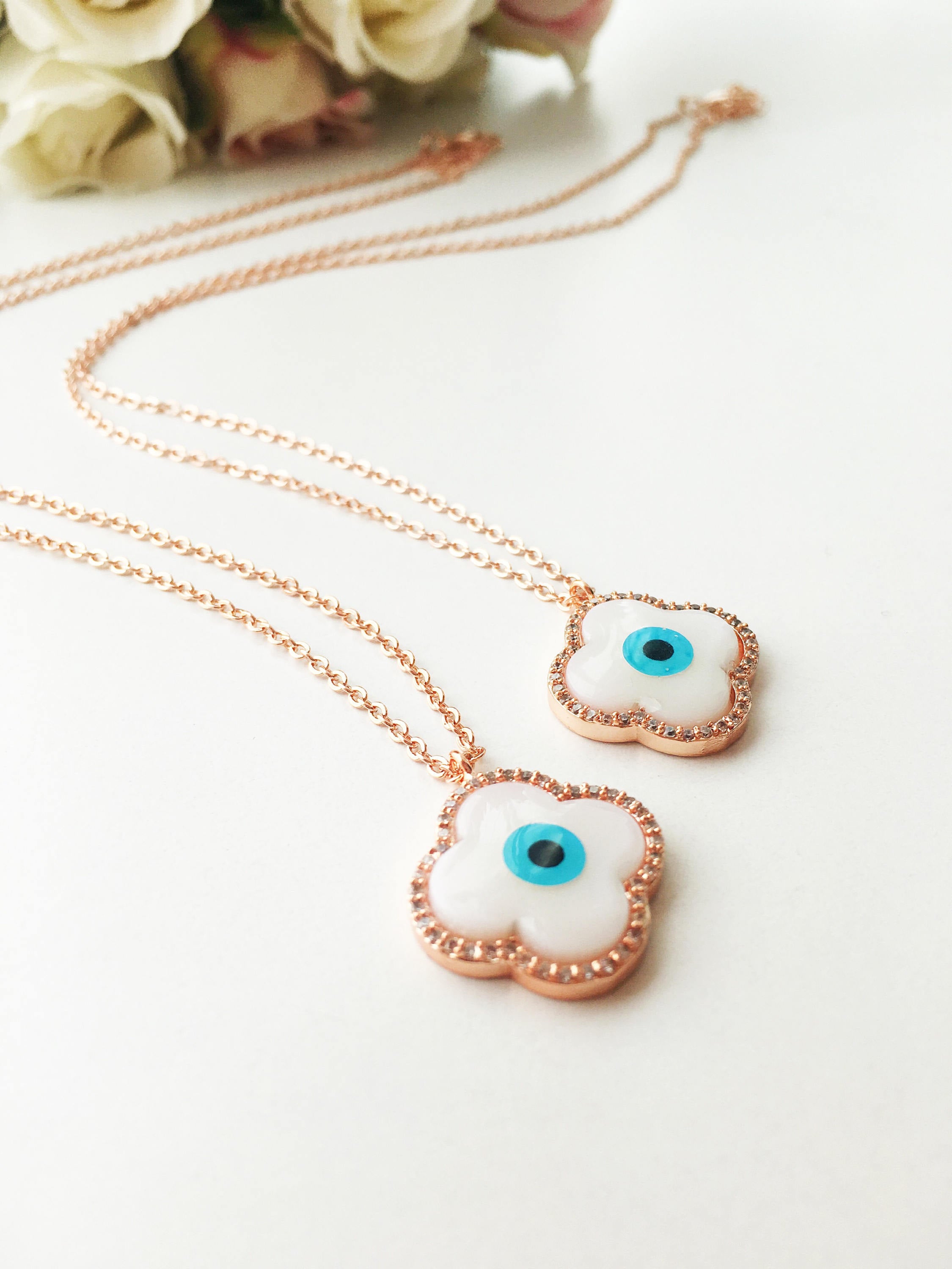 Handmade Clover Evil Eye Necklace featuring a mother of pearl charm and rose gold plating, adjustable chain length.