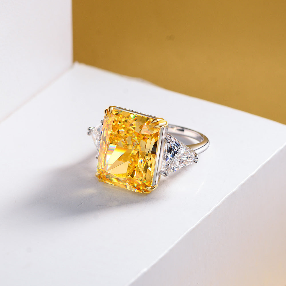 Cocktail Anniversary Fashion Ring featuring a cushion canary yellow cubic zirconia and sterling silver setting, showcasing a bold and elegant design.