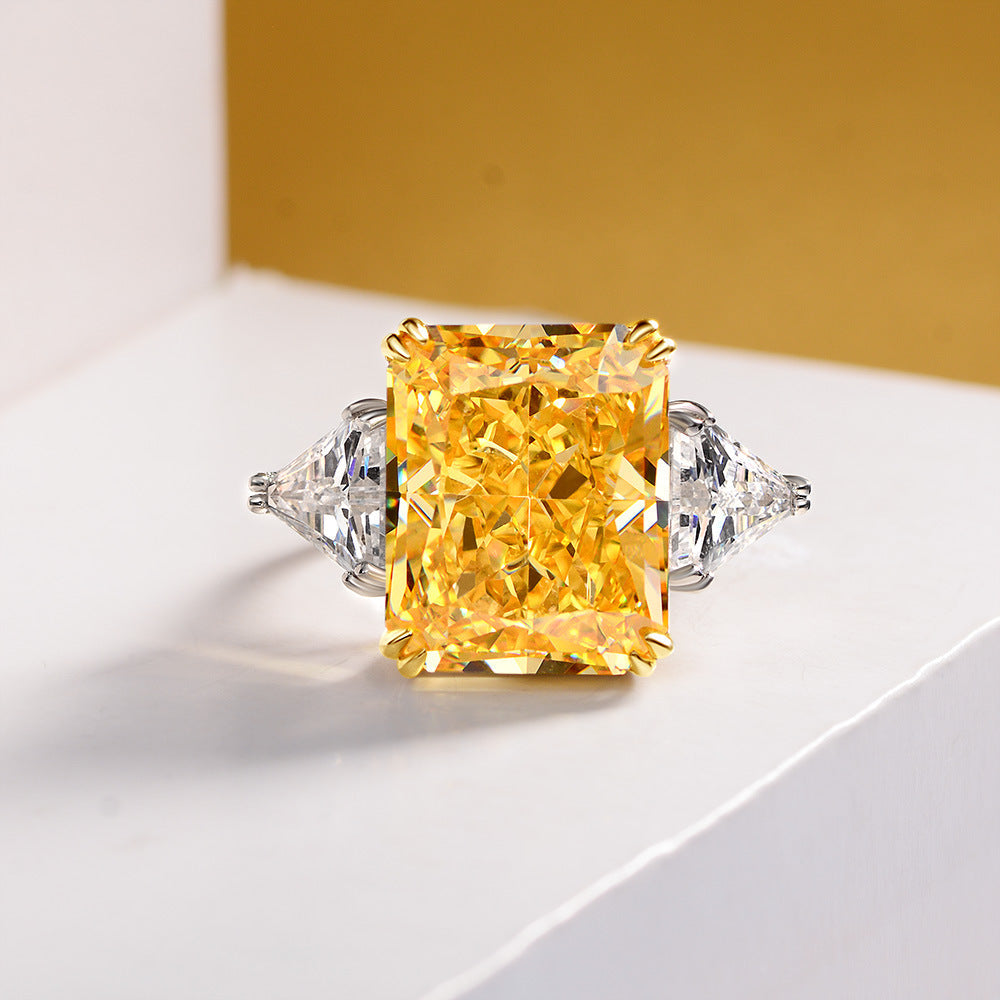 Cocktail Anniversary Fashion Ring featuring a cushion canary yellow cubic zirconia and sterling silver setting, showcasing a bold and elegant design.