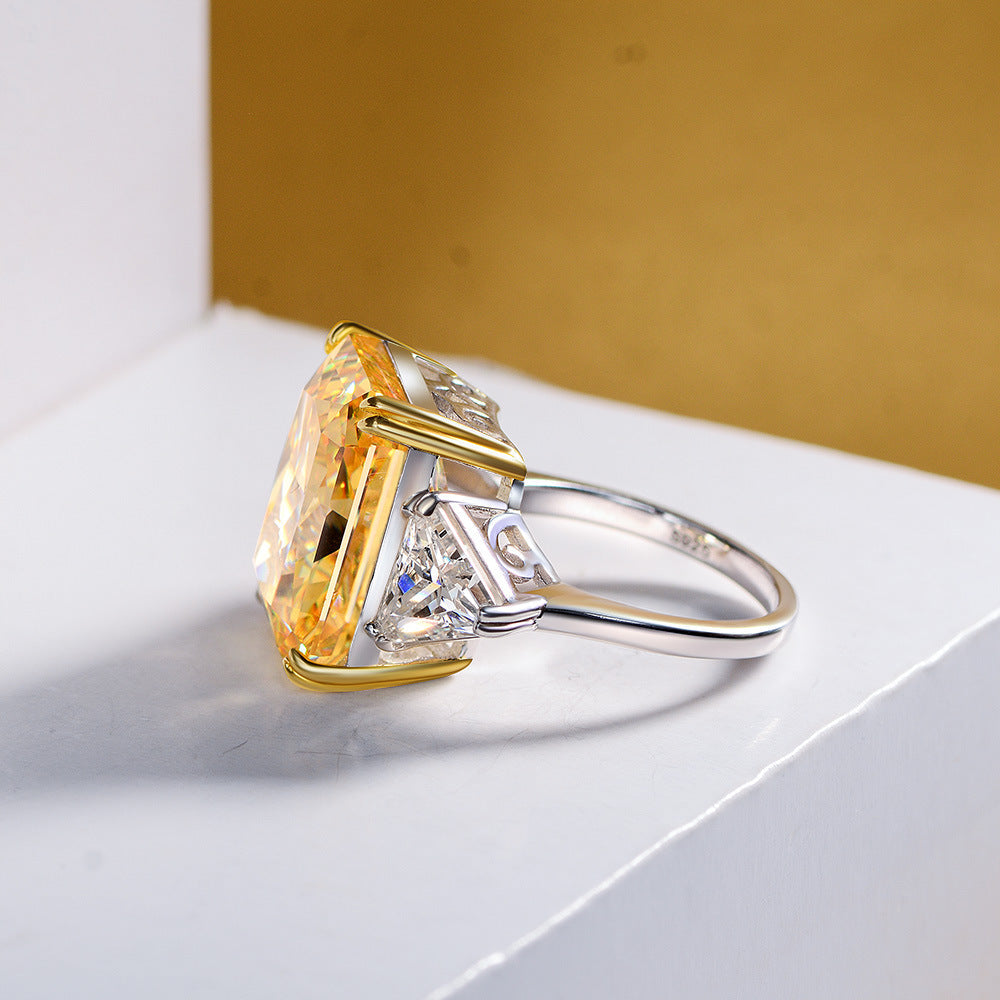 Cocktail Anniversary Fashion Ring featuring a cushion canary yellow cubic zirconia and sterling silver setting, showcasing a bold and elegant design.