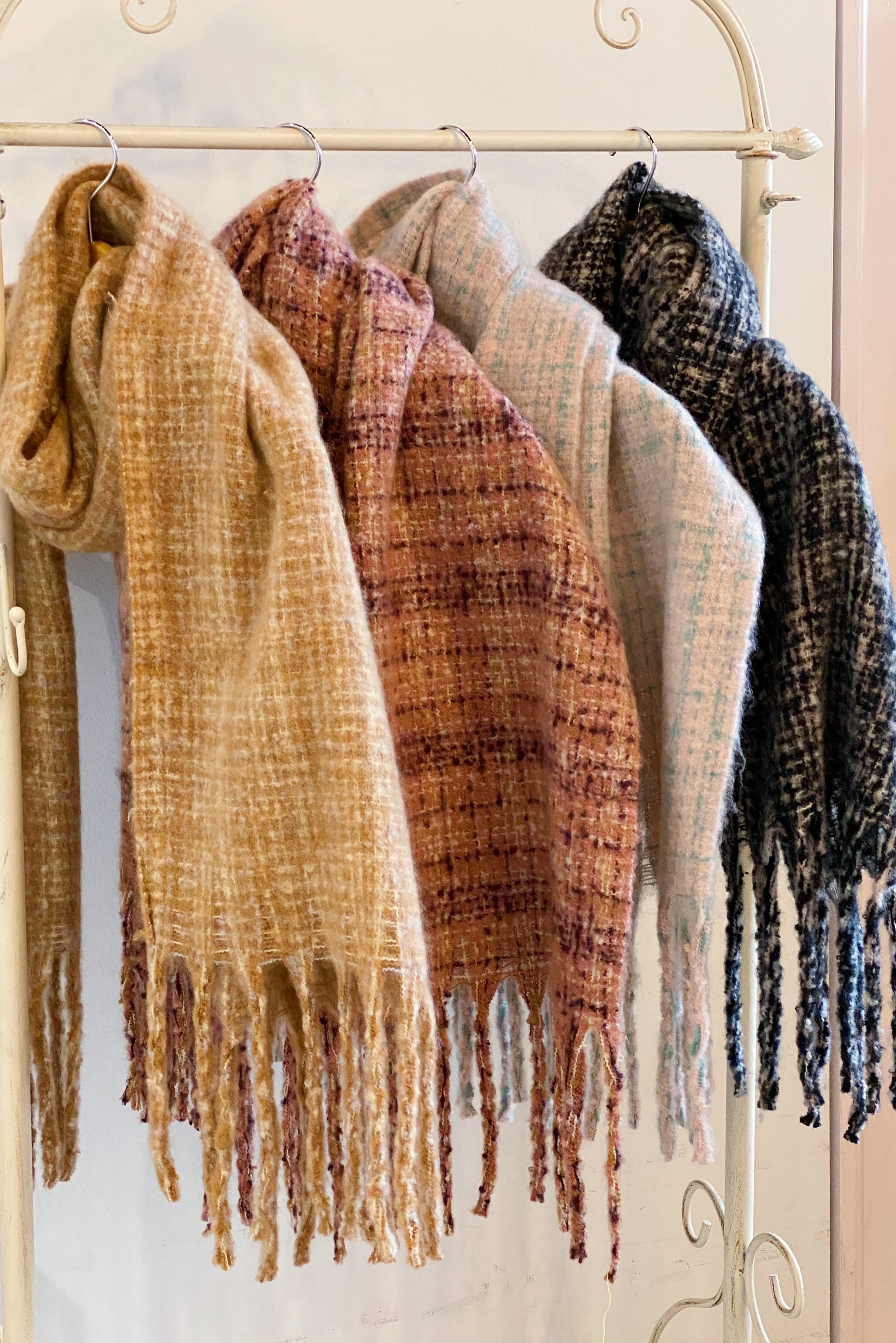 Coco Tweed Fringed Scarf showcasing its chunky texture and stylish fringed edges, perfect for winter wear.