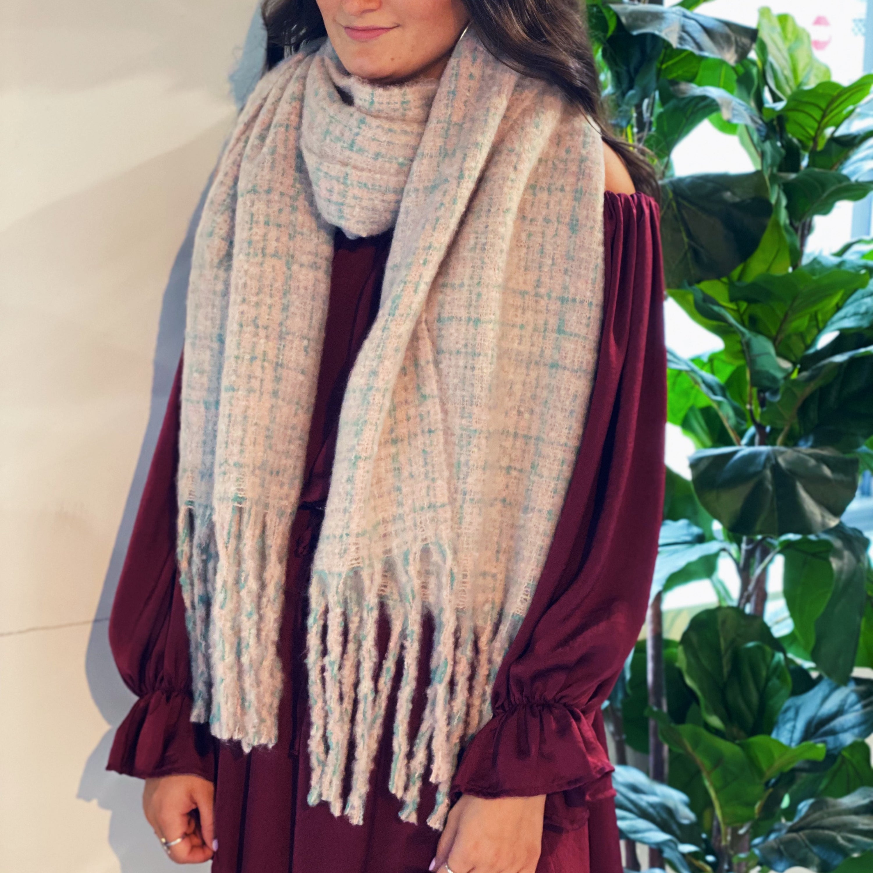 Coco Tweed Fringed Scarf showcasing its chunky texture and stylish fringed edges, perfect for winter wear.