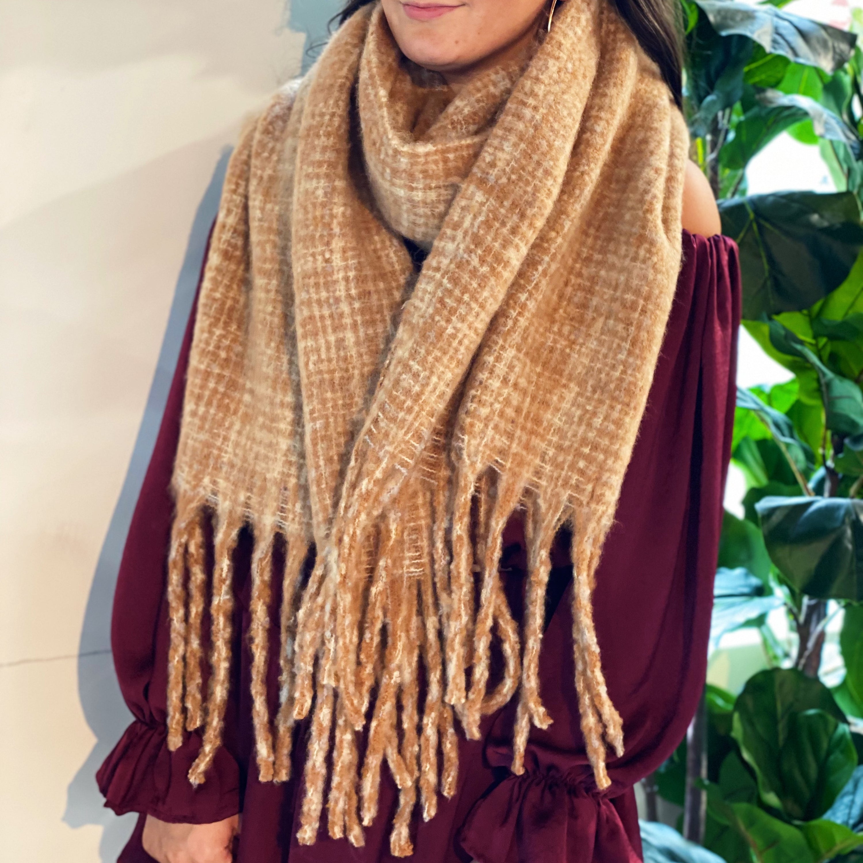 Coco Tweed Fringed Scarf showcasing its chunky texture and stylish fringed edges, perfect for winter wear.