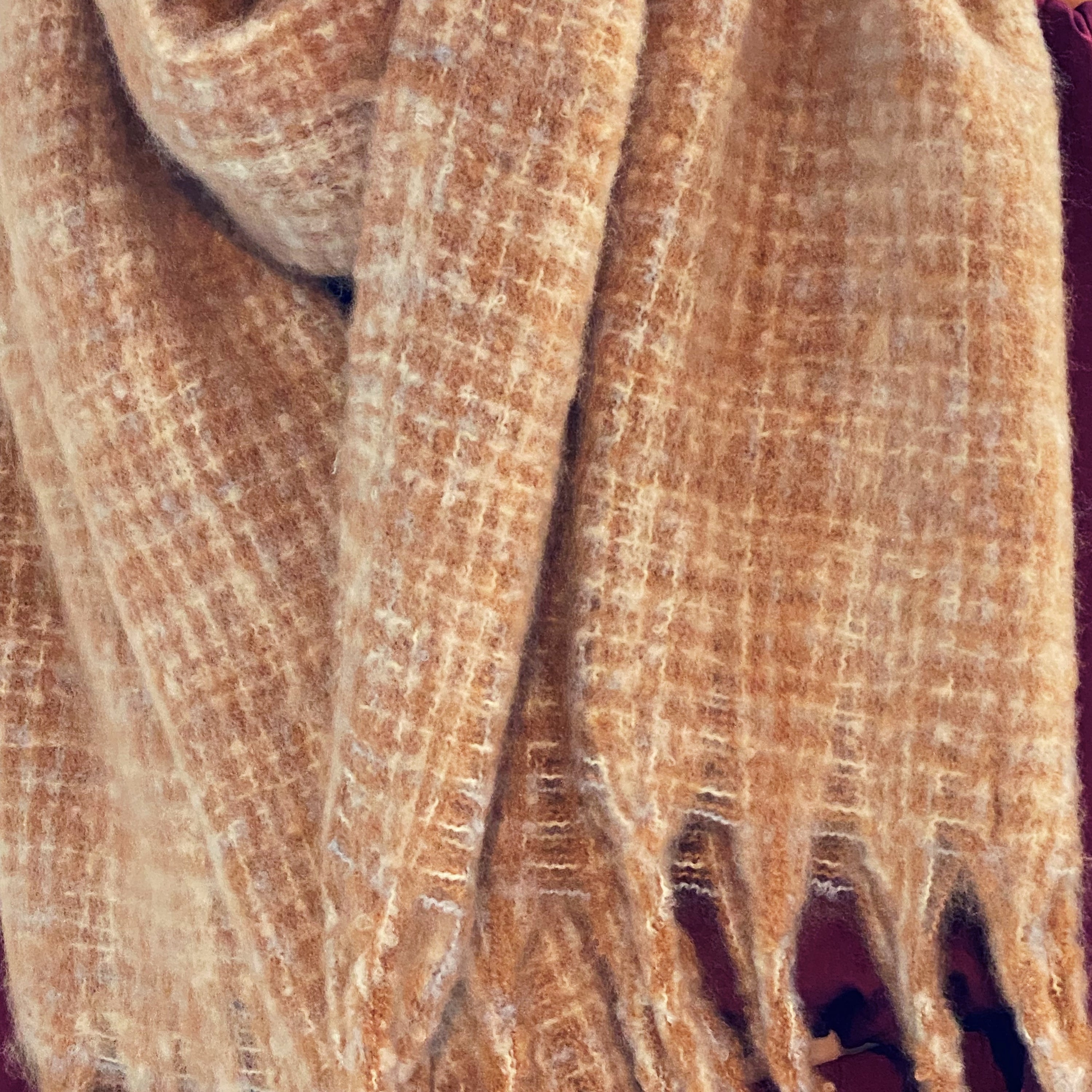 Coco Tweed Fringed Scarf showcasing its chunky texture and stylish fringed edges, perfect for winter wear.