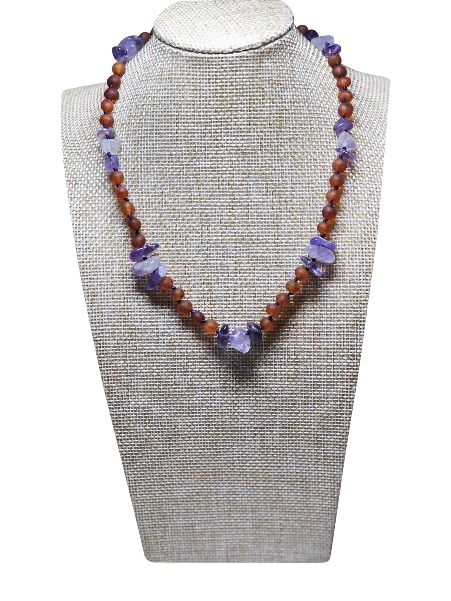 Cognac Amber + Amethyst Kids necklace featuring purple hues and individually knotted beads for safety, designed for children aged 4-15.